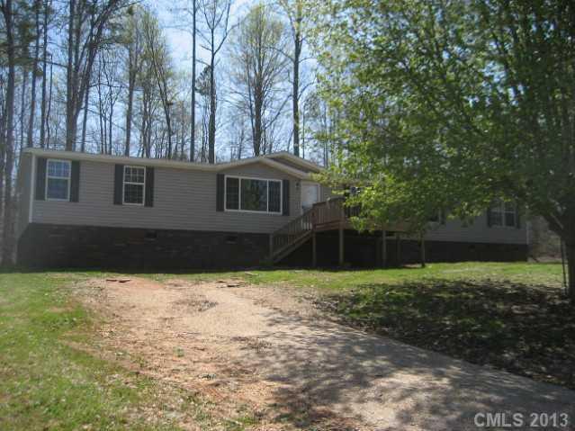Very nice home features 4 large bedrooms, 2 decks, fresh paint, new carpet, has an additional great room/bonus room with a fireplace and a wet bar. Home sits comfortable on 1.25 acres.
