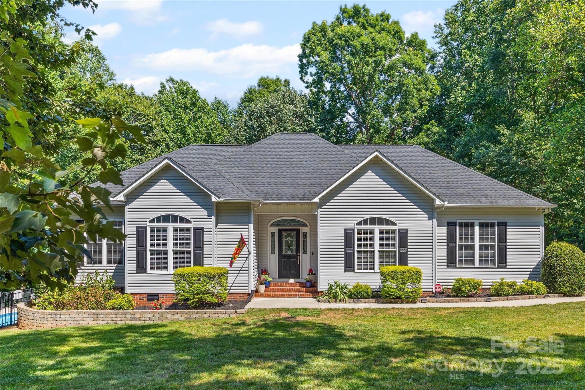 This gorgeous and well-maintained 3-bedroom, 3.5-bath ranch home sits on a spacious 1.74-acre lot in a highly desirable neighborhood within the sought-after Clover School District. Featuring a split-bedroom layout and open floorplan, this home offers both comfort and functionality. The beautifully updated kitchen and bathrooms add a modern touch, while the versatile bonus room upstairs—with a walk-in attic—provides plenty of space for your needs. There’s also a dedicated office that could serve as a 4th bedroom. Step outside to a fully fenced backyard complete with an inviting inground pool—perfect for relaxing or entertaining. With low HOA fees and a central location between Clover, York, Rock Hill, and Lake Wylie, this home truly has it all.