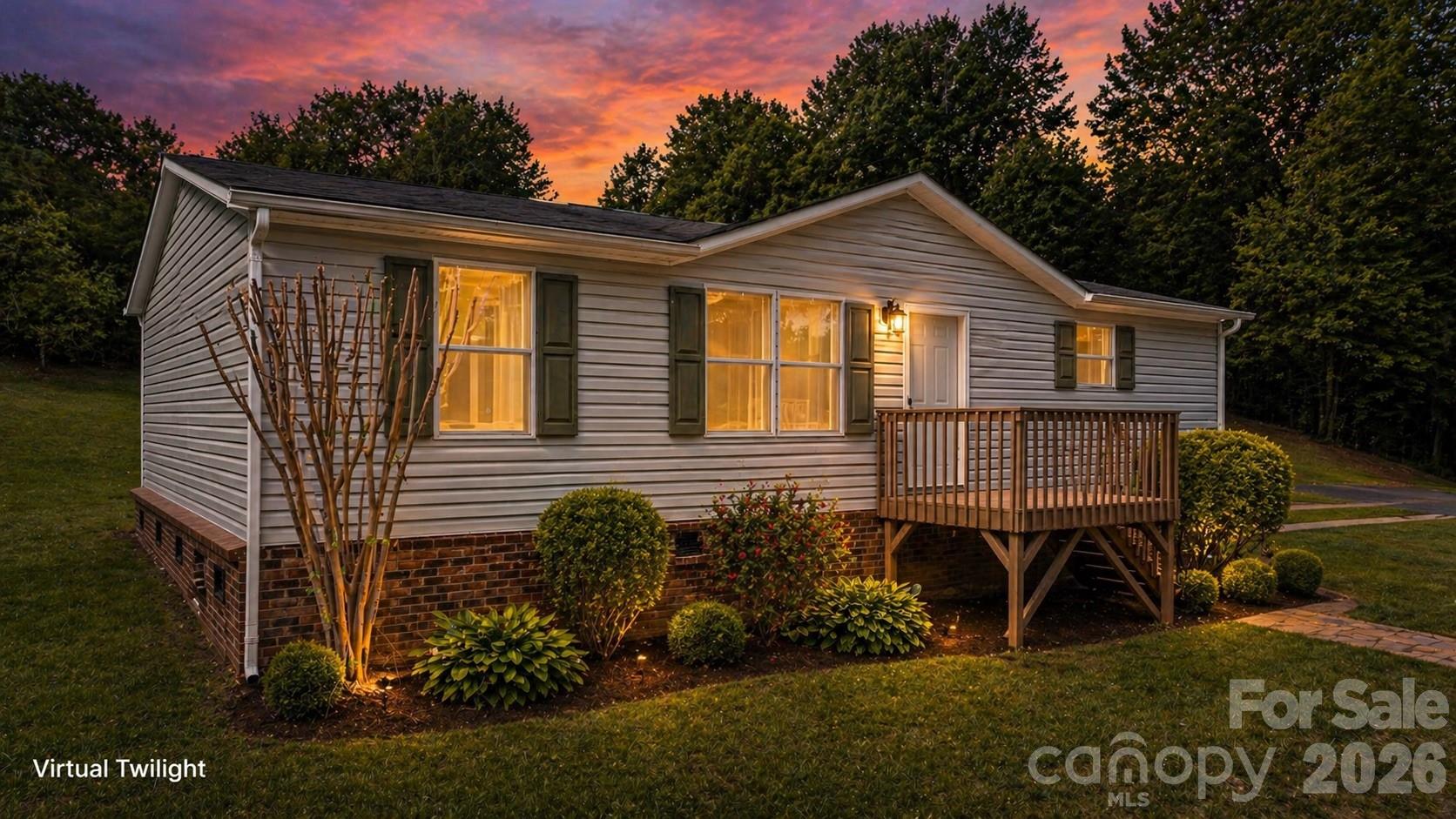 Private and move-in ready 3BR/2BA home situated on 1.2 wooded acres offering space, flexibility, and a peaceful setting just outside of town. This home features an open living area, large kitchen with abundant cabinet space, stainless range, ample countertop workspace, and a dedicated dining area perfect for everyday living.

The spacious primary suite includes a large ensuite bath with double vanity, garden tub, separate shower, and generous closet space. Fresh, clean interiors with updated flooring and neutral finishes make it easy for the next owner to move right in and make it their own.

Enjoy outdoor living with both front and side decks, ideal for relaxing, grilling, or entertaining while overlooking the wooded surroundings. The oversized lot offers additional parking, flexibility, and potential for future use.

Conveniently located just minutes from Drexel, Morganton, local schools, shopping, dining, and easy access to I-40 and Highway 70, this property offers both privacy and everyday convenience.

A great opportunity for primary living, rental investment, or a peaceful mountain-area getaway.