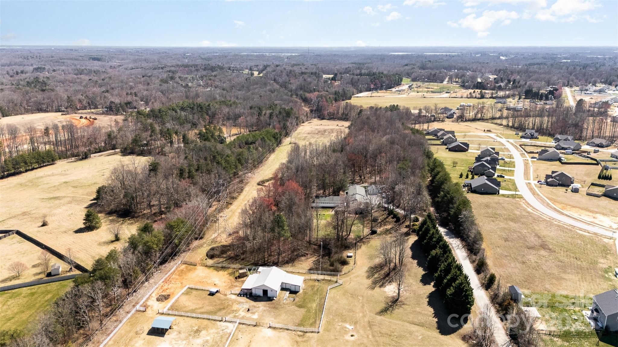 Stunning equestrian and dog boarding facility on over 20 acres. Conveniently located in the heart of Kernersville with easy access to Winston-Salem, Greensboro, and High Point.
This property includes a successful, established kennel business and a well-appointed owner's residence with beautiful views of the rolling pastures. Horse enthusiasts will appreciate the spacious barn, fenced paddocks, and riding areas, while the fully operational boarding facility features climate-controlled kennels, grooming areas, and ample play space for canine guests.
The Willow Run Kennel has been in operation for almost 40 years during which they served almost 10k dog and cat owners. Gross business income is $340k+ annually. The facility contains 60 indoor/outdoor kennels and is licensed for 85 dogs. The barn has 5 stalls and additional 2 partially enclosed, as well as 2 pastures. The additional acreage available presents a lot of opportunities for expanding the dog business or equestrian facility.