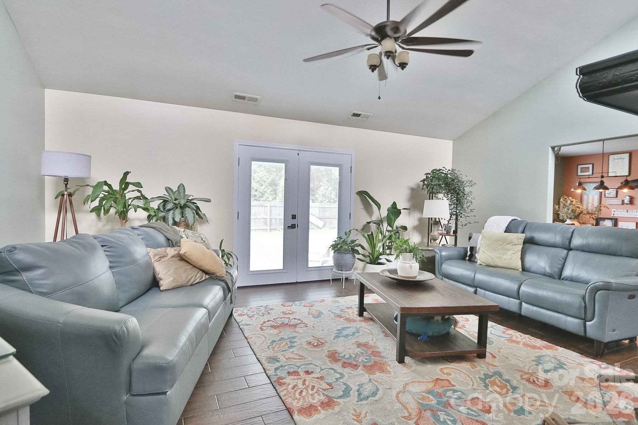 MOVE-IN READY and beautifully maintained 3BR/2.5BA home on .59 acres in Winston-Salem!  Spacious 3BR/2.5BA home on .59 acre lot offers the perfect blend of warmth, character, and modern convenience. Filled with natural light, the thoughtfully designed floor plan features a stunning living room with vaulted ceilings and a dramatic floor-to-ceiling brick wood-burning fireplace. Double doors open to a private outdoor patio, creating an inviting space for entertaining or relaxing. The heart of the home is the kitchen, complete with an island, new stainless steel appliances, abundant cabinetry, and generous prep space. Just off the kitchen, a deck overlooks the backyard, providing the ideal setting for morning coffee or evening gatherings. The spacious primary suite offers an updated ensuite bath, while two additional bedrooms provide plenty of room for family, guests, or a home office. A dedicated laundry room and attached two-car garage add everyday convenience. Outside, enjoy the privacy and possibilities of a large, usable yard with plenty of space for gardening, recreation, pets, or future outdoor projects, plus a storage shed for added functionality. Combining stylish updates, exceptional care, and desirable indoor-outdoor living, this move-in-ready property is one you won't want to miss! Just minutes from downtown Winston-Salem. Schedule your private tour today.
