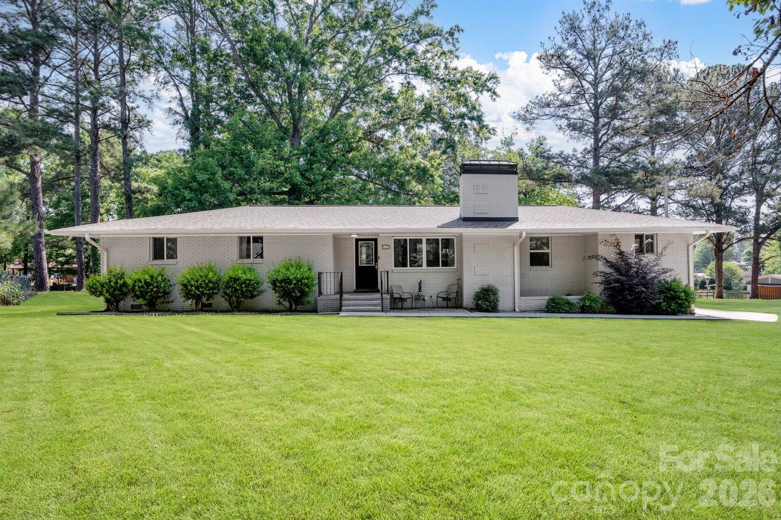 JUST REDUCED!!!! HEART OF  DOWNTOWN PINEVILLE !  NO HOA ! LAREGE LEVEL LOT!!! What a RARE find/opportunity! Come see this  completely remodeled  in 2021 FULL  brick ranch on a peaceful LARGE lot  with mature trees on just under an acre Room to  grow here!  Sought after location! OPEN floor plan ,easy clean laminate floors throughout , neutral color scheme , stainless appliances and granite counter tops , custom built deck that accommodates the private  hot tub  which is included!  4 bedrooms, 2 full baths. Waling distance to famous historic  Pineville ! Enjoy the local shops and restaurants and the new Library too! If outdoors is your preference you less than a mile from Pineville Lake Par & Dog Park! ! Enjoy the Greenway access Lake, Walking trails, playground, Shelter, and Free splash pads . A truly one of a kind home .
