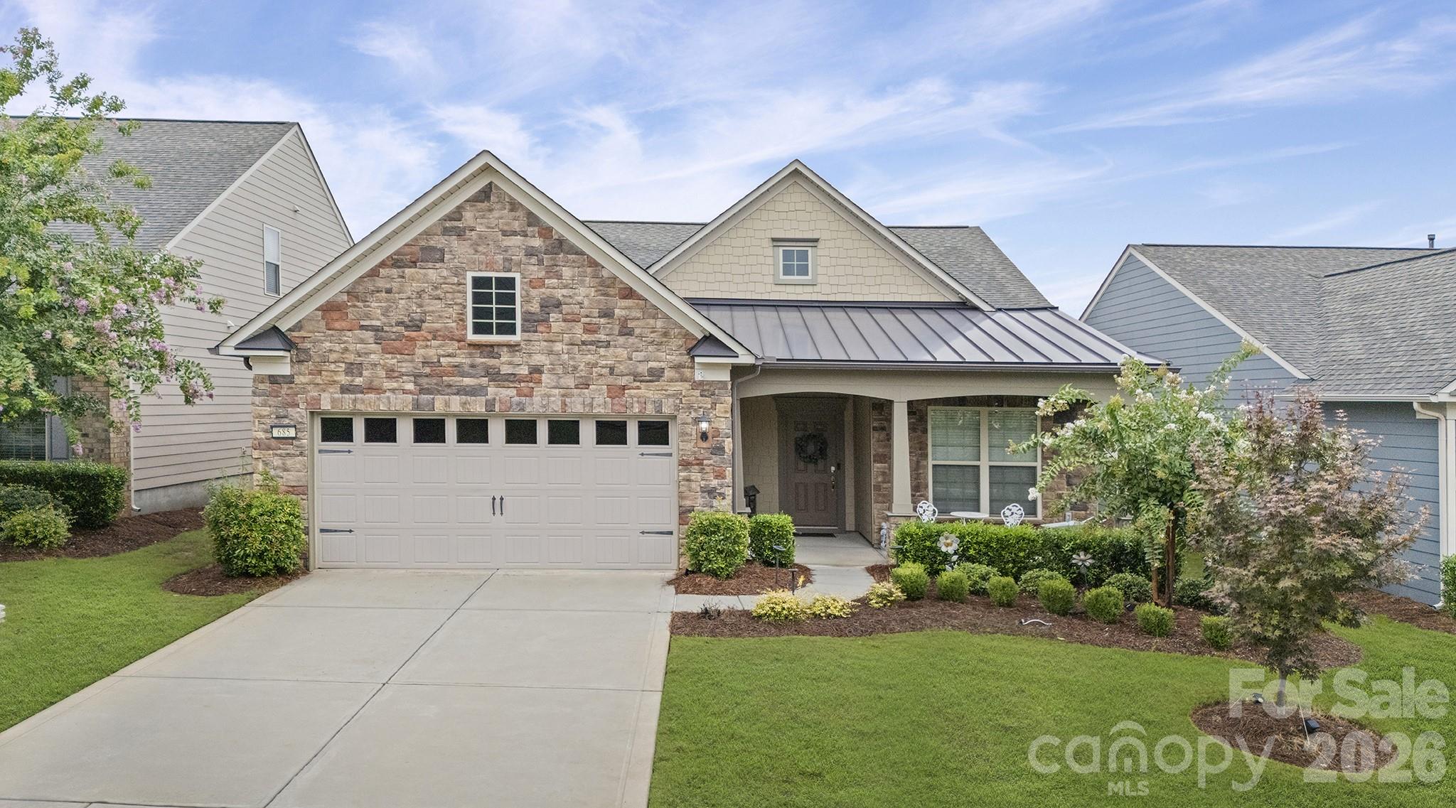 Welcome home . . . Martin Ray model is the favorite of the Expedition Series. This pristine 1 level home offers numerous upgrades. Vinyl plank & tile flooring - no carpet. Open concept living, great for indoor/outdoor entertaining. Upgraded Kitchen, KitchenAid ss appliances, gas cooktop, double ovens, refrigerator inc, large island w/seating, pendant lights. Upgraded light fixtures. Great Rm w/stone fireplace w/raised hearth. Sunrm leads to screened porch, Primary BR w/tray ceiling. Primary Bath w/soaking tub, tile shower, custom walk-in closet. Laundry Rm w/sink, cabinets, washer/dryer inc. Drop Zone leads to 2 car+tandem, Garage w/epoxy floor, 3 4x8 overhead storage bins, Lawn maintenance included. Ring alarm equipment includes 5 cameras, 7 motion sensors, 4 door sensors. Tons of amenities--indoor/outdoor pools & hot tubs, 8 lit pickleball cts, 4 lit tennis cts, 2 bocce cts, dog park, playground, fitness center, full time activities director. Come join us in the Orchards. It' a great place to call home.