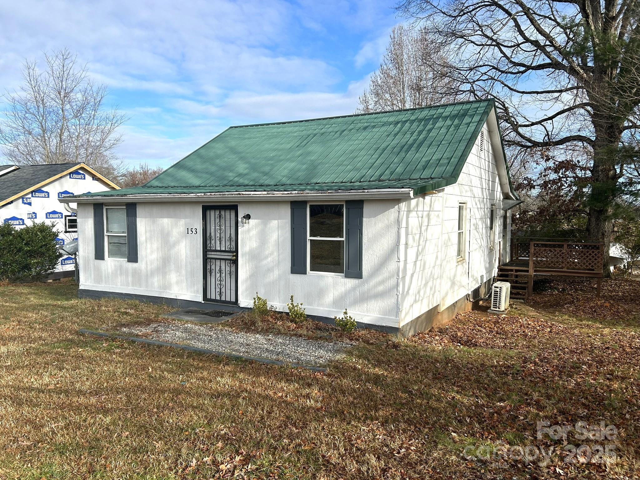 Affordable 3BR home in convenient Spindale location, yet well off the main roads reducing thru traffic. Bonus entry area/room opens to large living room creating a nice open feel. The 3rd BR is smaller but has a closet, would make a good office/den. Updated bathroom. There are 2 mini splits for heat/air as well as baseboard heat in most rooms.  Metal roof in 2015 and plumbing & electrical upgraded in 2016 according to previous owner. Side deck. Level backyard area would be a good spot for a garden. Laundry room not counted in heated square footage.