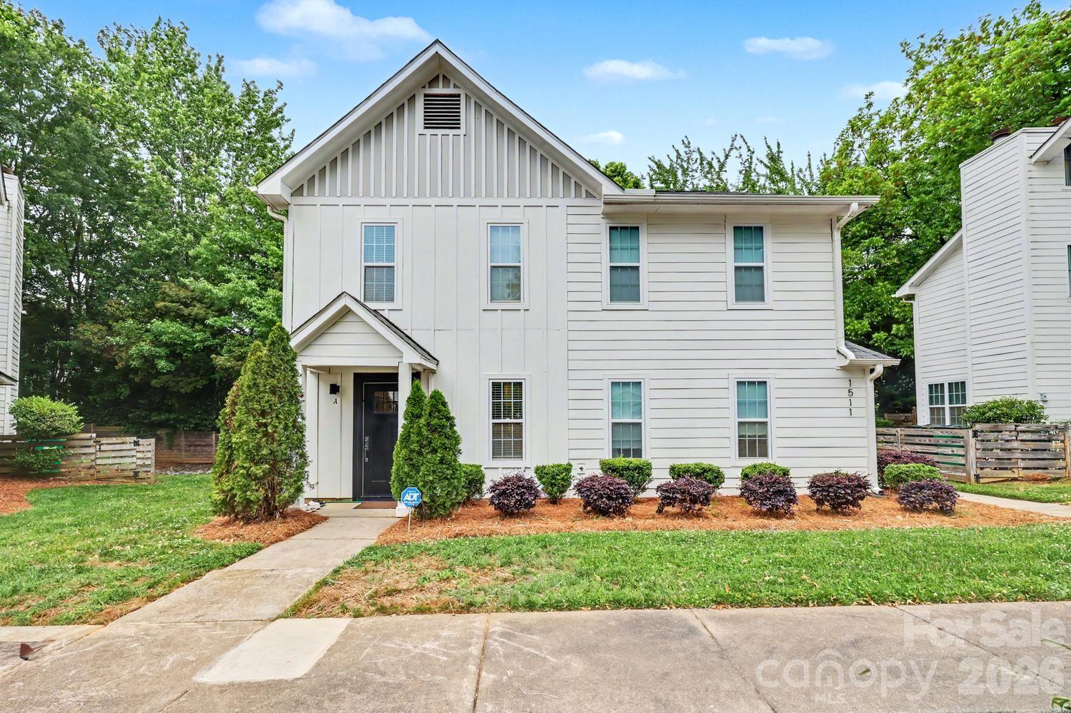 Welcome to 1511-A Briar Creek Rd. Located on a prime lot in the Midwood Place townhome project, this 2 bed 1 1/2 bath property shows beautifully with an open floor plan, modern updates and is well located with easy access to shops and dining in the Plaza Midwood area and convenient  access to Independence freeway, Elizabeth neighborhood and uptown/southend areas. Renovations in 2019 include a new roof, siding, hvac and windows new flooring and paint.  The modern updated kitchen includes sleek cabinetry with good storage,  quartz counters, bar with seating and stainless steel appliances. The kitchen opens  to a living space with a fireplace and  french doors that lead  out to a sunny private  patio and fenced yard. The second floor has 2 bedrooms both with ensuite baths. The primary has a tiled shower and walk in closet. The home is assigned with 2 parking spaces and there are guest spaces throughout. This property is well maintained by the current owners and is the perfect place to call home!