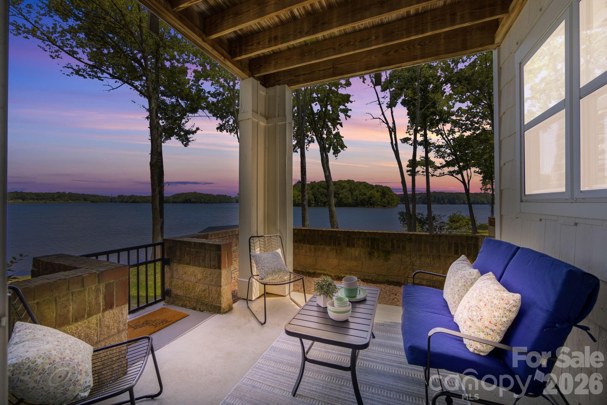 GROUND FLOOR LAKEFRONT LUXURY IN SPINNAKER REACH!
2 BR | 2 BA | Lake Davidson Waterfront | Move-In Ready

Wake up to breathtaking water views every single day! This stunning, move-in ready ground-floor condo on the shores of Lake Davidson perfectly blends effortless waterfront living with unbeatable town convenience. Walk straight from your private patio to the water’s edge, or grab your kayak for a peaceful ride on the lake.

Key Updates & Premium Features |
Mechanical Peace of Mind: Brand-NEW HVAC and NEW Hot Water Heater—the expensive systems are completely taken care of!
Well-Maintained Interior: Freshly painted throughout with updated lighting and beautiful, low-maintenance luxury vinyl plank (LVP) flooring through the main living areas. Original kitchen and bathrooms have been well maintained. 
Open-Concept Living: The bright, cheerful kitchen overlooks the dining and living spaces, drawing your eye straight to panoramic lake views. Features a cozy fireplace with gas logs.
Spacious Layout: Desirable split-bedroom floor plan. The primary suite boasts lake views, a walk-in closet, and a large bath with a separate tub and shower.
Excellent Storage & Extras: Interior storage room, coat closet, and additional large pantry closet. Dedicated laundry room includes a newer washer/dryer that conveys!

The Lake Davidson & Town Lifestyle |
Enjoy resort-style community amenities just steps away, including a lakefront pool, community boat dock, and kayak storage.

You truly cannot beat this location |
0.5 Miles: Grocery, dining, and shopping.
1.5 Miles: Historic Main Street, Davidson College, and the famous weekly Farmer’s Market.

Whether you are looking for a full-time residence, a weekend getaway, or a second home away from home, this rare ground-floor gem delivers the ultimate Davidson lifestyle. Schedule your showing today!