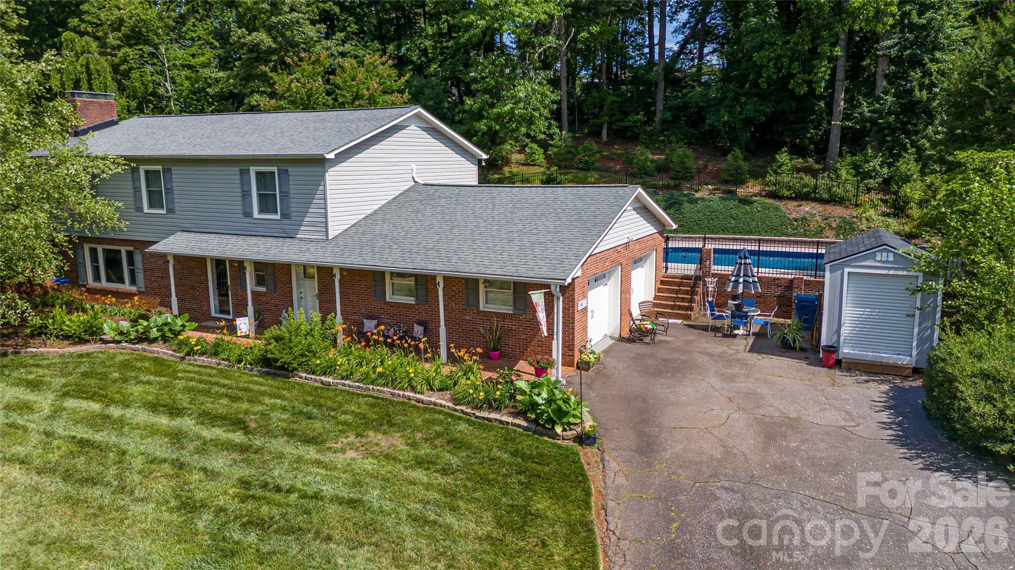 Must see this 4BR 2.5Bath 2 story home in one of Burke counties most recognized neighborhoods. This home offers approx 2400 heated sf including spacious main floor with large living room w/wood burning fireplace, open updated kitchen with newer white shaker cabinets and granite countertops and all appliances, Range, Refrig, microwave, dishwasher and washer & dryer plus bonus refrig in garage. Home also boast oversized 2 car garage with epoxy floor and large driveway for entertaining guest. Upstairs you have 3 good sized bedrooms and spacious primary bedroom and bath. Plus, 2 of the bedrooms upstairs have direct access to rear deck and pool area. A main attraction of this home is the pool area and large deck great for family & friends get togethers. All this and only minutes to Hickory, Morganton and beautiful Lake James. Don't miss this home!