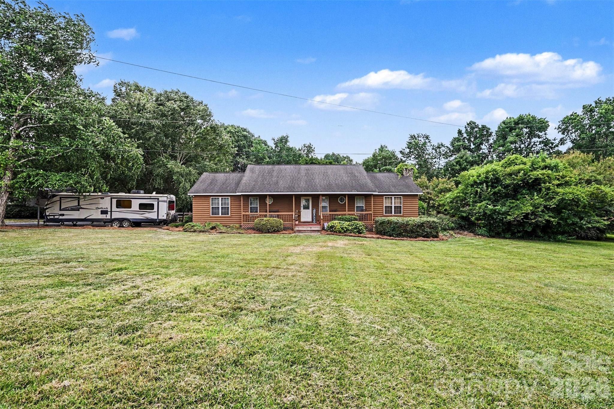 Rare 10.03-acre private estate canvas in Matthews (Union Co. taxes). Home to the beloved "Christmas on the Farm," this exclusive acreage blends a secluded retreat lifestyle with 5-minute access to downtown. Prime opportunity for premier developers or high-net-worth buyers to build a custom modern estate. Existing septic on-site with sewer lines nearby. Current residence & big red shop convey; all other outbuildings, gates, & enclosures excluded unless negotiated. Build your legacy here!