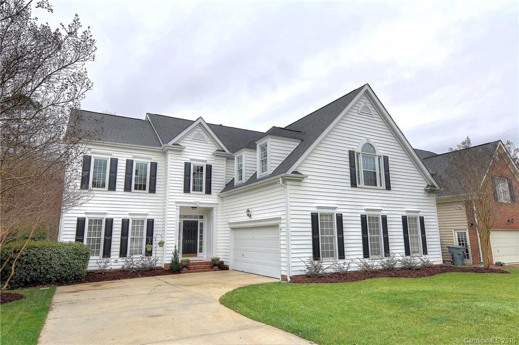 Impressive main level with 2-story formal areas separated by columns, beautiful hardwoods, extensive moldings & designer kitchen open to great room. Upstairs master suite has hardwoods, double trey ceiling and bay window sitting area. Flexibility of a main level guest room plus upstairs bonus/5th bedroom. Extended deck and custom patio overlook wooded privacy. Meticulously maintained 1 owner home has new roof in 2012, new HVAC units & new tankless water heater. Great location and top schools!