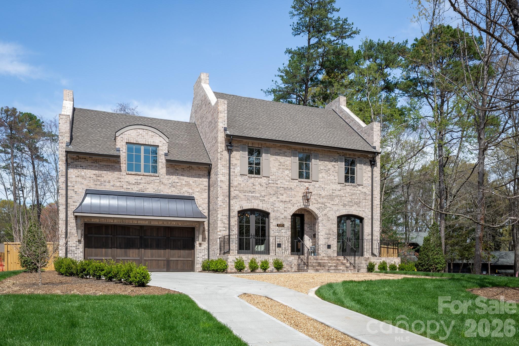 Stunning new construction by THR Design Build on .54 acre lot in Jefferson Park. One of a kind custom built two story home with heated saltwater POOL and SPA. This ENERGY STAR home includes 5,316 sf, 6 BR, 5 full BA, 1 powder room, a bonus room, office, 2 fireplaces, a 2 car garage, and prewired for electric car. Enter the main entryway with dining room to the right and office to the left, and continue on to the open family room and kitchen.   The open space expands through the 16 ft accordion slider doors onto the 375 sf covered, screened in, outdoor patio with fireplace. A thoughtfully designed kitchen includes 48" Thermador Dual Fuel range below hand crafted hood, 48" Thermador refrigerator, and Theramor dishwasher. The Scullery includes a farmhouse sink, Thermador 24" wine cooler column with cabinet panel, Thermador 24" beverage fridge column with cabinet panel,  Thermador dishwasher, and microwave. Other features include oversize Pella windows and doors, dual Trane high effic heat pumps, and 2 Rinnai tankless WH. 10 foot ceilings on the main level and 9 foot celings on the upper level.  Expansive primary suite with washer/dryer hookup in the closet.  Close to Providence Day, Country Day, The Fletcher School, and Charlotte Prep.