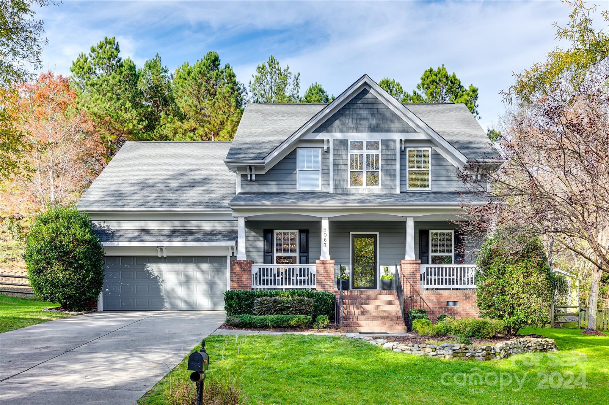 Welcome to this well-maintained, beautifully updated, 4-bedroom home nestled in the heart of Tega Cay. This spacious home offers an ideal combination of modern updates & classic charm. Step inside to a bright & inviting open floor plan, featuring hardwood throughout the main level & plenty of natural light throughout. Gourmet kitchen boasts an oversized island, s/s appliances, marble countertops, perfect for cooking & entertaining. Primary suite located on the main level is a true retreat, with a large walk-in closet & a luxurious en-suite bathroom featuring a jacuzzi tub, dual vanities, & a separate shower. 3 additional generously sized bedrooms & bonus room upstairs. Outdoor you'll find a beautifully landscaped, fenced yard with a screened patio & basketball sport court—perfect for relaxation & outdoor fun! The home is just minutes from top-rated schools, golf course & access to Lake Wylie & walking trails offering a perfect blend of suburban tranquility & active lifestyle amenities!