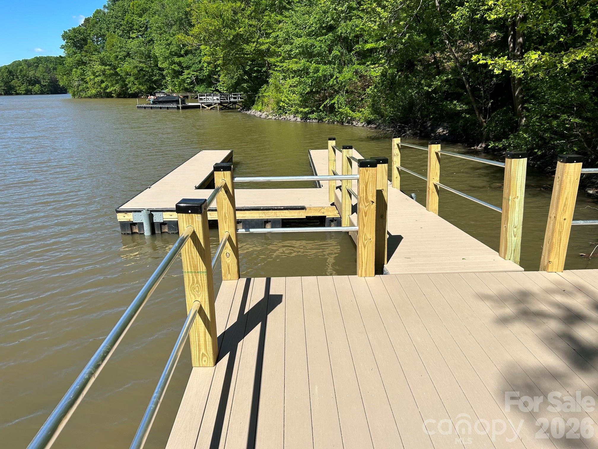 Waterfront homesite with an existing dock already in place. The gently sloping topography is ideally suited for a walkout basement design, allowing you to maximize usable living space.

Located near the end of a quiet cul-de-sac in the desirable Ridgewood community, this property offers the flexibility to build on your timeline with the builder of your choice. Documentation from a previously approved 4-bedroom septic permit is available for reference. The community features a peaceful setting with many undeveloped lots, providing privacy and a spacious feel.

Enjoy the benefits of low Iredell County taxes while remaining conveniently located near the downtown areas of Catawba, Claremont, and Troutman. You'll also be just minutes from public boat access and approximately 10 minutes from Lake Norman State Park, offering hiking, biking, swimming, camping and outdoor recreation opportunities.