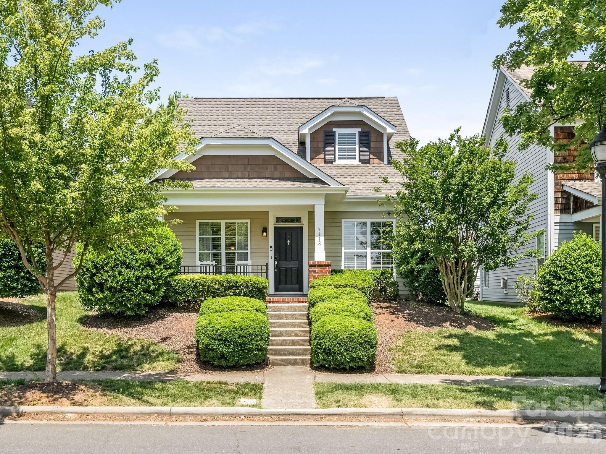 Beautifully updated 3BR/2BA 1.5-story home in desirable Blakeney Greens featuring two fully remodeled bathrooms with elevated finishes and a new roof installed in May 2026. Inviting living room with gas log fireplace, kitchen with black granite countertops, built-in pantry, and abundant storage throughout. Functional floor plan offers two bedrooms and a full bath on the main level, plus a private upstairs primary bedroom retreat and full bath. Rich wood flooring downstairs with carpet on the stairs and in two bedrooms. Enjoy outdoor living on the oversized travertine-tiled patio in the courtyard with a grassy area, perfect for relaxing or entertaining. Detached rear-load two-car garage completes this move-in-ready home in a sought-after location.