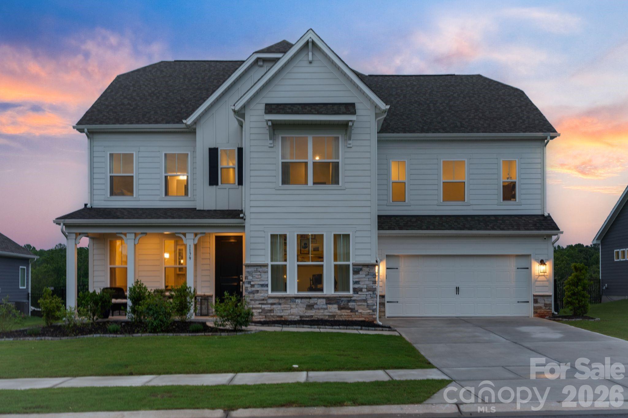 Located within Indian Land's tranquil Sugar Creek community, this beautifully appointed 4-bedroom, 3.5-bath home offers a rare opportunity to own a truly move-in ready residence in one of the Carolinas' most celebrated and fastest-growing areas. Recently completed in 2025, the home blends elevated finishes and thoughtful design with an effortlessly livable layout, all just minutes from everything that makes this corner of the Charlotte metro so special.

The main level opens through a welcoming foyer into a space designed for both everyday living and effortless entertaining. A private office just off the entry provides a quiet retreat for working from home, while the dining room sets the tone for elevated gatherings with a custom built-in bar, integrated wine and beverage refrigerator, and SONOS ceiling speakers. The gourmet kitchen serves as the true heart of the home, featuring quartz countertops, crown-molding cabinetry, a stainless steel cooktop and double wall ovens, a custom built-out walk-in pantry, and an upgraded refrigerator with a freezer drawer. The living room centers on a gas fireplace and opens directly to a covered patio, flowing into a fully fenced backyard with peaceful, open views. A custom drop zone with built-in cubbies connects seamlessly to the three-car tandem garage, finished with custom epoxy flooring.

Upstairs, the primary suite serves as a true private retreat, featuring a tray ceiling and a spa-inspired bath with a freestanding soaking tub, dual vanities, a walk-in tiled shower, a private water closet, and dual walk-in closets. Three additional guest bedrooms each include walk-in closets, one with a private ensuite bathroom, and two sharing a hallway bathroom, alongside a loft, a bonus room, and a dedicated laundry room with a new washer and dryer. Smart home features include Lutron switches, Ring doorbell, SONOS in select areas, and a smart thermostat. Ideally positioned with quick access to I-77, Baxter Village, and the full breadth of Indian Land and Fort Mill's dining, retail, and recreation, this home offers an effortless connection to Uptown Charlotte and Charlotte Douglas International Airport, delivering the best of both worlds in one exceptional address.