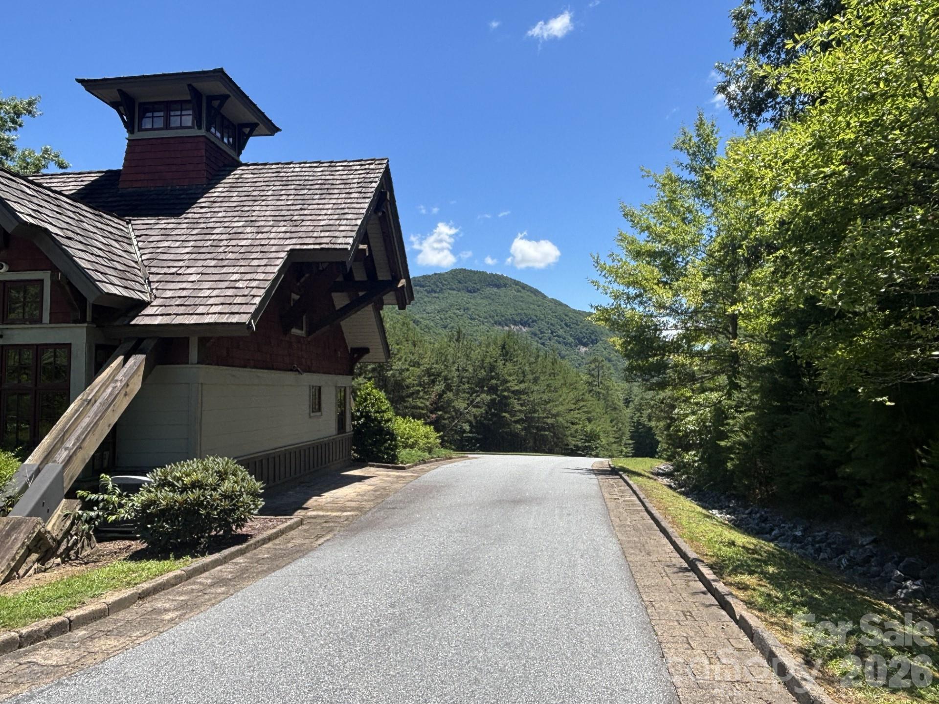 Build Where Wildlife Still Roams Free!
Be welcomed home by wild turkeys, graceful deer, and the occasional black bear as you enter the gates of Grey Rock at Lake Lure—a mountain community thoughtfully designed to preserve its natural beauty and abundant wildlife. Lot 246 offers 1.64 acres with a spacious, level building site, providing the perfect setting to capture beautiful mountain views while enjoying the peace and privacy of the surrounding forest.

Located within this gated community, residents enjoy well-maintained paved roads, underground utilities, and a minimum 1,800-square-foot build requirement that helps maintain the neighborhood's quality and character. Convenient dual entrances provide easy access to Lake Lure, Chimney Rock State Park, Buffalo Creek Park, Weed Patch Mountain, Old Fort, and endless opportunities for hiking, boating, fishing, kayaking, golf, and outdoor adventure.

If you've been searching for a mountain homesite where nature takes center stage and your dream home can become a reality, Lot 246 offers the rare combination of buildability, breathtaking scenery, and a lifestyle unlike any other.