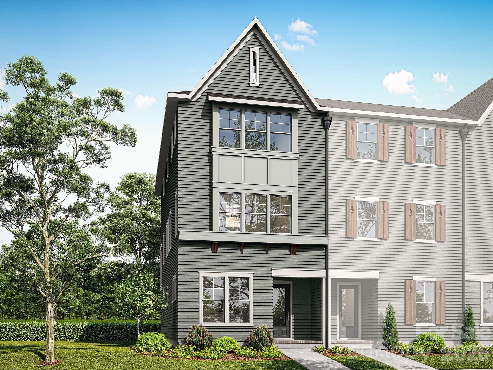 NEW CONSTRUCTION in East Charlotte - This corner unit townhome boasts tons of natural light and is one of six in this gorgeous building.  The first level offers one guest suite with a private bath - walk in shower with ceramic tile walls and floor.  The common area is located on the middle level and provides an open concept design with family room, dining area and kitchen with quartz counter tops, under cabinet lighting and center island with single bowl stainless kitchen sink.  Electric fireplace in the family room with judges paneling backing. Luxury vinyl plank flooring standard in all common areas with carpet in bedrooms and upper hallway. Iron picket stair railing with oak step treads on both staircases. Primary bedroom suite located on the upper level. Bath includes a double sink quartz vanity, oversized tiled shower and huge walk-in closet.  Upper-level guest suite has bath with tub/shower combo with ceramic tile walls and flooring. Laundry room on the upper level conveniently located near the primary bedroom and guest suite. Generously sized covered rear porch on the middle level for ultimate privacy and relaxation on warm evenings. Two-car attached garage with opener and 2 remotes included.