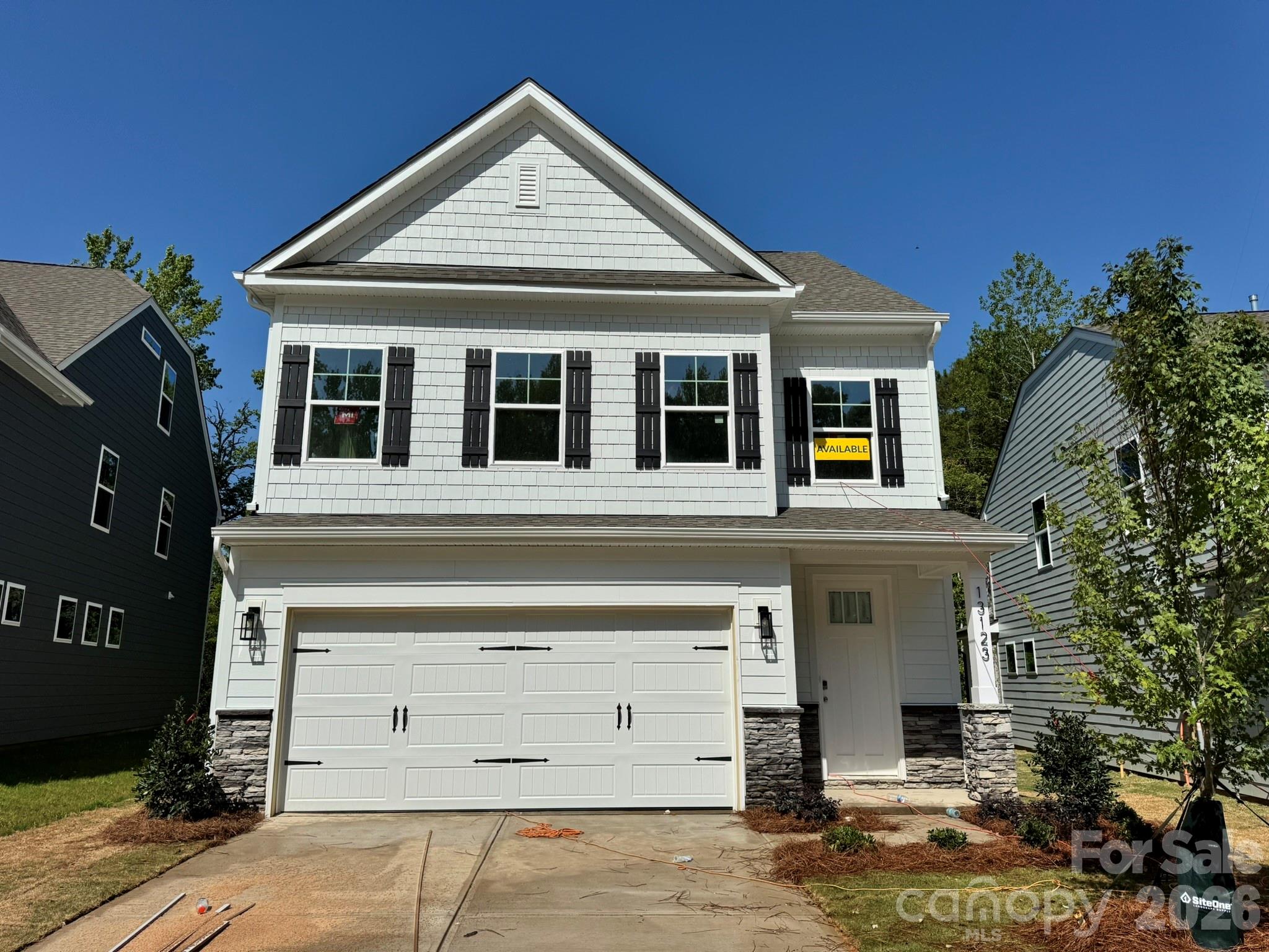 New boutique community in Charlotte near the University area with easy access to dining, retail, and interstates. This 3-story Clayton plan offers 3 bedrooms, 3.5 baths, a third-floor bonus room, a rear covered porch, and more than 2,900 square feet of living space. The main living area features the family room with Cosmo gas fireplace & shiplap feature wall, breakfast area that walks out to covered porch, and a designer kitchen. The kitchen has gray cabinets, quartz counters, tile backsplash, and stainless appliances including a range hood & gas cooktop. Upstairs features the primary suite with a luxury shower and large walk-in closet. The upper floor is completed with two more bedrooms, a hall bath with tub/shower combo, loft, and laundry room. The third floor has a large bonus room and full bath. Perfect for a gameroom or extra place to get away! All bathrooms have gray cabinetry and white quartz counters. Visit today and find out more about this exciting new community!