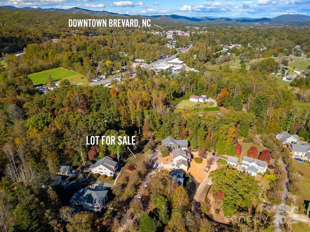 Located in Cadence Point Subdivision in the City Limits of Brevard this residential lot is prime for your new build. The lot is perfectly positioned up above the road and is adjoined by community green space. With prime Southern and eastern exposure there are stunning sunrises to be enjoyed from your front porch. There is access to city water, sewer, trash and recycling. The community POA dues of $106 per month includes yard maintenance. If you are looking for a quiet in town location to build your dream home schedule your showing today.