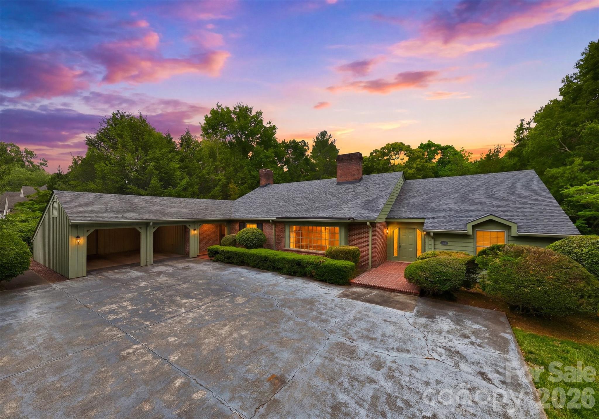Prestigiously positioned in the heart of Country Club Park, this distinguished one-owner estate offers an unparalleled blend of timeless craftsmanship, classic architecture, and an enviable walkable lifestyle. Just minutes from Lake Hickory Country Club, Viewmont Elementary, shopping, and dining. A Classic 1965 Custom Ranch sits on a beautiful level lot stretching from 5th St NW to 6th St NW, the home offers dual-street presence and convenience, with a private rear-entry garage discreetly accessed from 6th Street. Main Level – offers a study with custom built-ins and a charming window bench, a formal living room anchored by a grand bay window and elegant fireplace, a formal dining room ideal for hosting with ease, a warm, inviting den wrapped in heart-of-pine paneling and centered around a second fireplace, the kitchen features custom brickwork that surrounds cooktop + double ovens, abundant cabinetry, and a sunlit breakfast area. Seamless flow to a screened porch and open-air deck that overlooking lush, mature landscaping. The spacious laundry room has exterior access, and a convenient guest half bath just off the kitchen. Two main-level bedrooms, including a private primary suite and an additional bedroom with full bath. A walk-up attic offering exceptional expansion potential or generous storage.  **Lower Level features 3 well-appointed bedrooms sharing a large, thoughtfully designed full bath, the family room is highlighted by a striking mid-century corner fireplace. Unfinished utility space perfect for storage, workshop, or future customization. A Coveted Address with Enduring Appeal is nestled along iconic 5th Street NW, celebrated for its enchanting holiday lights tradition, this residence stands as a rare opportunity to own a legacy home in one of Hickory’s most sought-after neighborhoods. With its classic bones and extraordinary potential, it awaits a discerning new owner to elevate it into its next era of luxury.