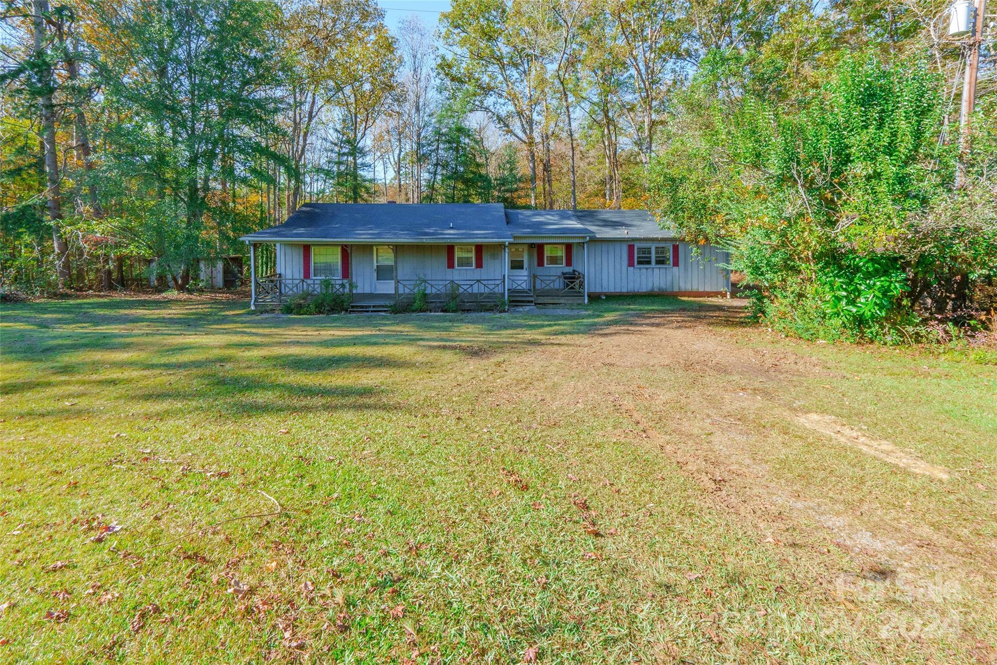 This ranch home is a hidden gem with endless potential, set on a large lot in a serene country-feel setting with no HOA close to shopping and dining. Featuring a spacious, covered front porch, it offers the perfect spot to unwind and enjoy the peaceful surroundings. While the home is in need of updates and modernization, it’s priced to sell and provides a fantastic opportunity to personalize and make it your own. The back of the house boasts a bright sunroom, ideal for enjoying year-round views. With its expansive lot, this property is a great investment for anyone looking to update and add value. Don't miss your chance to unlock this home's full potential! Home is being sold as-is.