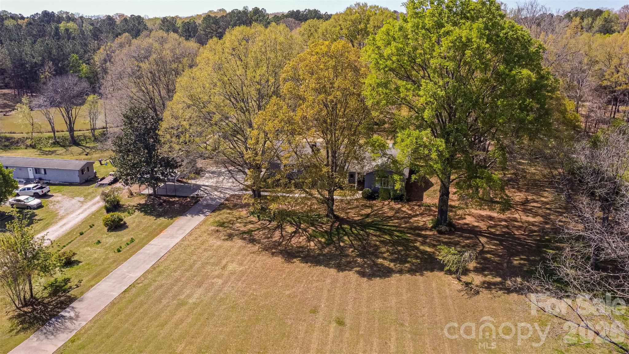 Welcome to 1471 Monroe Hwy in Lancaster, SC—a charming 3-bedroom, 2-bath ranch-style home offering 1,645 square feet of comfortable, single-level living on more than 2 private acres.Inside, the home has been freshly painted and features a thoughtfully updated kitchen and bathrooms, giving it a clean, modern feel. New light fixtures throughout add a stylish touch and enhance the home’s bright, inviting atmosphere. The functional layout offers comfortable living spaces perfect for both everyday living and entertaining.Outside, the property continues to impress with multiple storage sheds for tools, hobbies, or equipment, along with a detached carport in addition to the 2-car attached garage—providing ample space for vehicles, boats, or recreational gear.Whether you're looking for a private retreat or room to grow, this property delivers the space, updates, and versatility you've been searching for—all in a serene, well-positioned setting.This property blends a functional, well-designed layout with the kind of space and privacy that’s becoming increasingly rare. Enjoy peaceful surroundings and endless possibilities for outdoor living, whether you envision a garden, workshop, or simply a quiet place to relax and unwind. Conveniently located with a country feel yet still within easy reach of town, this home offers the perfect balance of comfort, flexibility, and opportunity.Tucked away on a beautifully positioned 2-acre homesite, this charming 1,645 sq ft home offers the perfect blend of privacy, space, and modern updates. Set back from the road and ideally centered on the property, you’ll enjoy a peaceful setting with plenty of room to spread out.