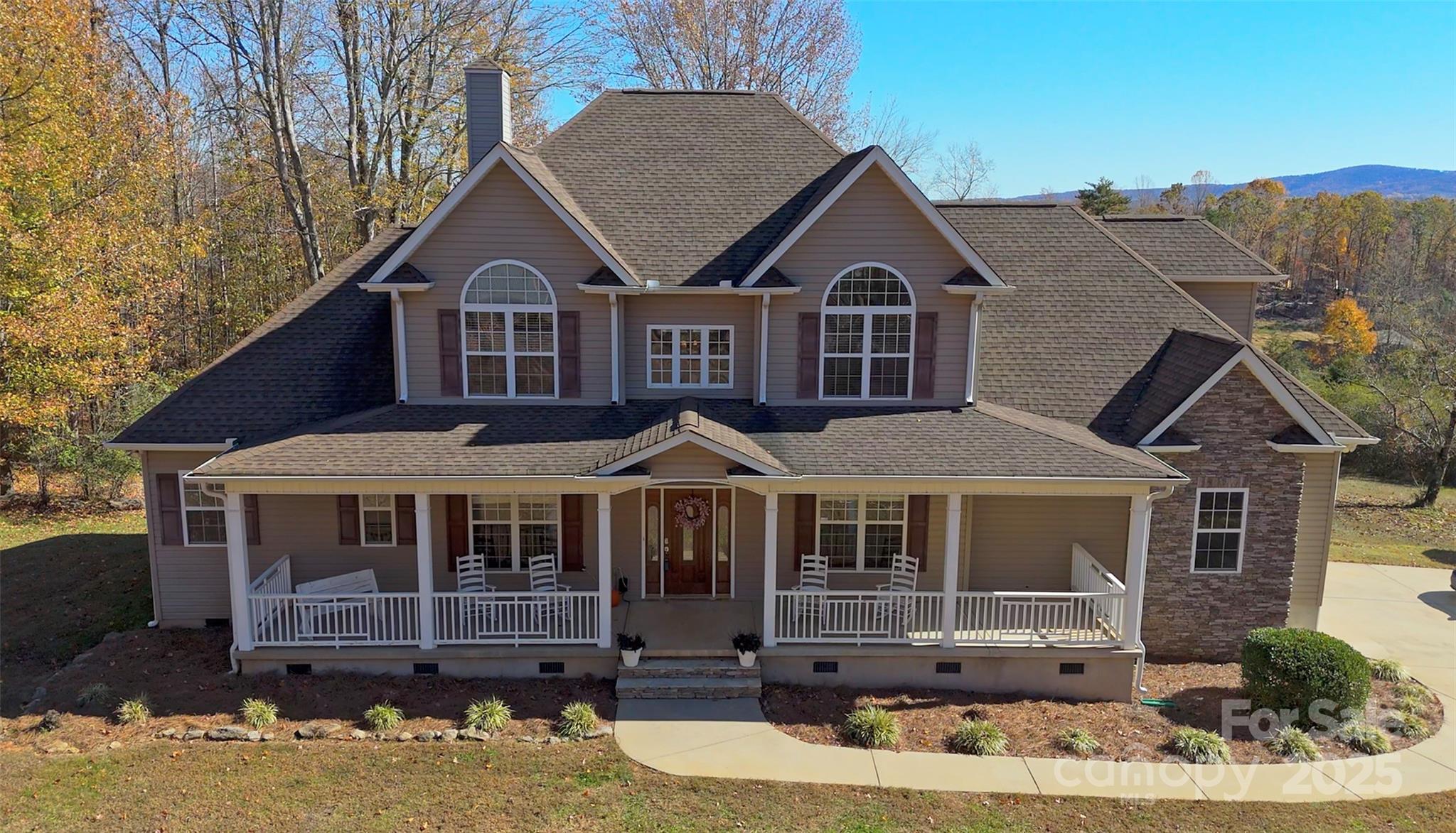Sought after Travelers Rest location is where you will find this 3.5 acre home. NO HOA & VIEWS OF PARIS MOUNTAIN is what you have been searching for. Big rocking chair front porch leads you into the foyer. Formal dining room on the right and double glassed doors lead you into the office/media room on the left. The 2 story living room features a gas log fireplace surrounded by stone. Don Gardner floor plan with HARDWOOD FLOORS through the main traffic areas. The kitchen offers a work island and high definition laminate counters with tiled backsplash and bay window breakfast area overlooking the back yard and mountain. The primary suite features TREY CEILING, DOOR TOTHE BACK DECK, DUAL WALK-IN CLOSETS, DUAL VANITIES, SEPARATE SHOWER and JETTED TUB. Upstairs overlooks into the living room and features 3 bedrooms, 2 baths and an amazing FLEX AREA for all your hobbies. Outside you are surprised to find a small SPRINGFED POND (the fish are in aquarium in garage) + extra storage down in the woods for boats, toys, etc. You can be at one of my favorite restaurants, Chicora Alley, in under 10 minutes and super easy access up Hwy 25 to Hendersonville and Asheville.