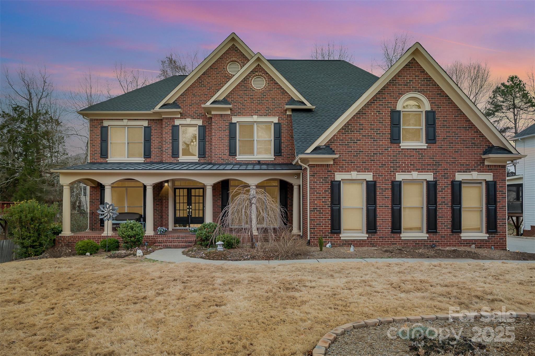 This stunning John Wieland home sits on a flat 1/3-acre lot with a fully finished basement. Custom finishes include refinished hardwood floors (2024), crown molding, transom windows, built-ins, & tray ceilings. The gourmet kitchen features freshly painted cabinetry, SS appliances, quartz counters, & tile backsplash (2020). A grand 2-story living room with a floor-to-ceiling gas fireplace creates the perfect ambiance. Highlights include an open loft/library with built-in bookshelves, a spacious primary suite with two walk-in closets (one custom), and an attached sitting room ideal for an office or lounge. The walk-out basement offers a bedroom, bath, and living areas, plus three unfinished rooms for extra bedrooms or storage. The exterior boasts a lush fenced yard with new sod and sprinkler system, refinished deck, and rocking chair front porch. Updates: new roof (2024), water heater (2023), and HVAC (2020). Convenient to CLT airport, schools, PNC Pavilion, shopping, and restaurants!