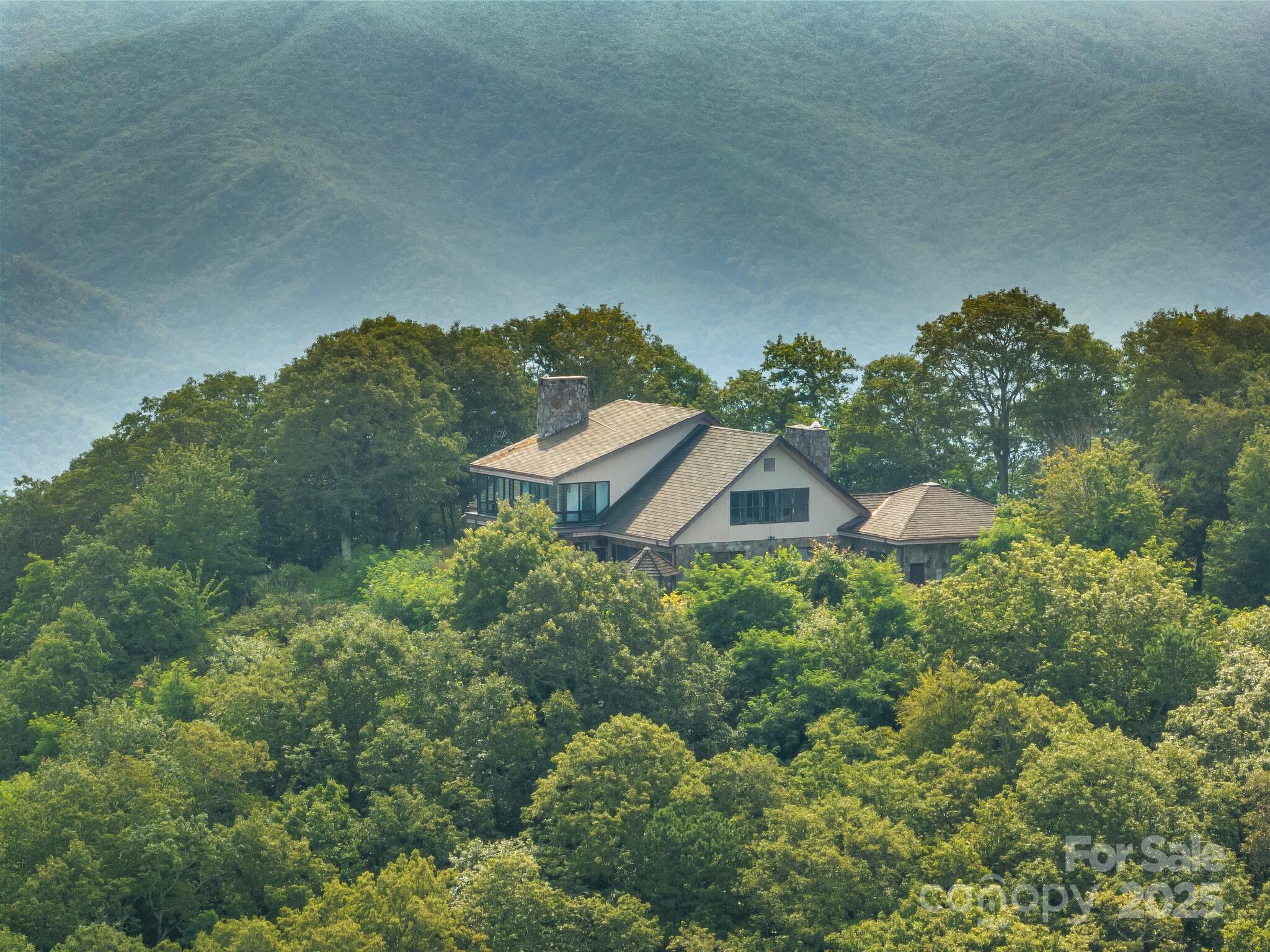 Discover the beauty and seclusion of 169 stunning mountain acres in Waynesville, North Carolina. This expansive property offers panoramic views, abundant wildlife, and endless opportunities for outdoor recreation. A home is situated on the land, currently in need of repairs due to hurricane damage, offering the perfect opportunity to restore or redesign to your vision. Whether you’re seeking a private mountain retreat, investment opportunity, or future development potential, this property is a rare find in one of Western North Carolina’s most scenic areas.
The estate offers sweeping, tri-state views of the Blue Ridge Mountains. Elevation@5,000 Cold Mountain, Mount Pisgah, Balsam Mountain, and Max Patch—each a breathtaking landmark. Savoring the peace and serenity or embracing adventure, this is truly your own piece of heaven on earth. History noted in agent remarks- call agents for details.