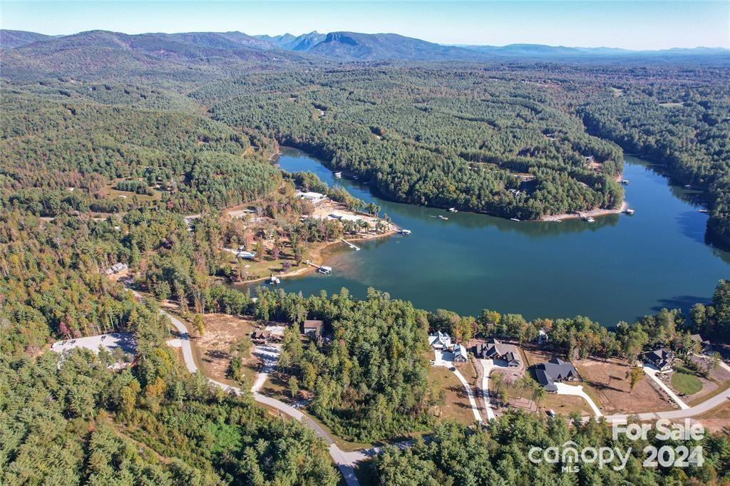 This 1.28 acre interior lot is located in the gated waterfront community of The Peninsula at Lake James. Owner financing is an option if needed! A great gently sloping lot to build your dream home within walking distance of Lake James. This land could be your primary residence or vacation home. Short term rentals are allowed. Gently rolling with possible winter views of Shortoff Mountain and Hawks Bill Mountains. Community well in place for use. Community amenities include a waterfront pool with picnic area and bathrooms, floating community day dock, and boat storage. Located minutes away from Black Bear Marina, Fonta Flora Brewery, or Fonta Flora trail for hiking and mtn biking. Only 18 min to Marion, 20 min to Morganton, 40 min to Linville Falls, 1 hour to Asheville and 1.5 hours to Charlotte airport. You are in the middle of the best of the Blue Ridge Mountains!