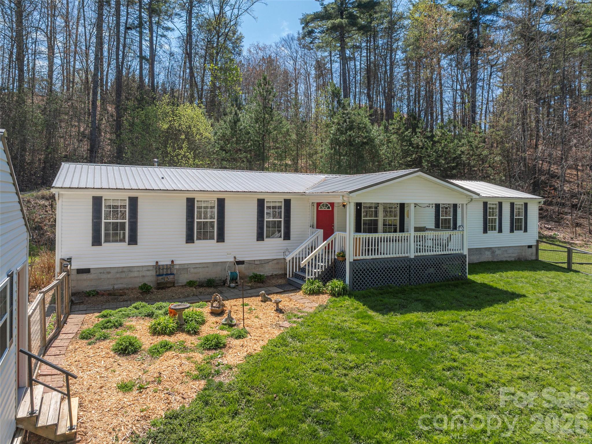 Discover the perfect blend of comfort & rural serenity in this stunning 3-bedroom, 2-bathroom home. Tucked
away on a secluded 2-acre lot, this property offers privacy & a peaceful atmosphere that is hard to find.
Originally acquired in 2016 this home’s updates at the time included: new metal roof, new
flooring throughout, new cabinetry, new heat pump, updated lighting, new wood burning stove (installed by
Willow Creek), new kitchen appliances, new water heater, & fully painted. The heart of the home is the
fully reimagined kitchen, featuring beautiful new cabinetry that perfectly complements the home’s fresh,
contemporary feel. The thoughtfully designed split-bedroom floor plan ensures maximum privacy. Outside,
the large covered front porch invites you to sit back & enjoy the quiet stillness of your expansive
property. More recently a large workshop/storage building with power was added to the property. Home and
storage building equipped with a Simply Safe security system.