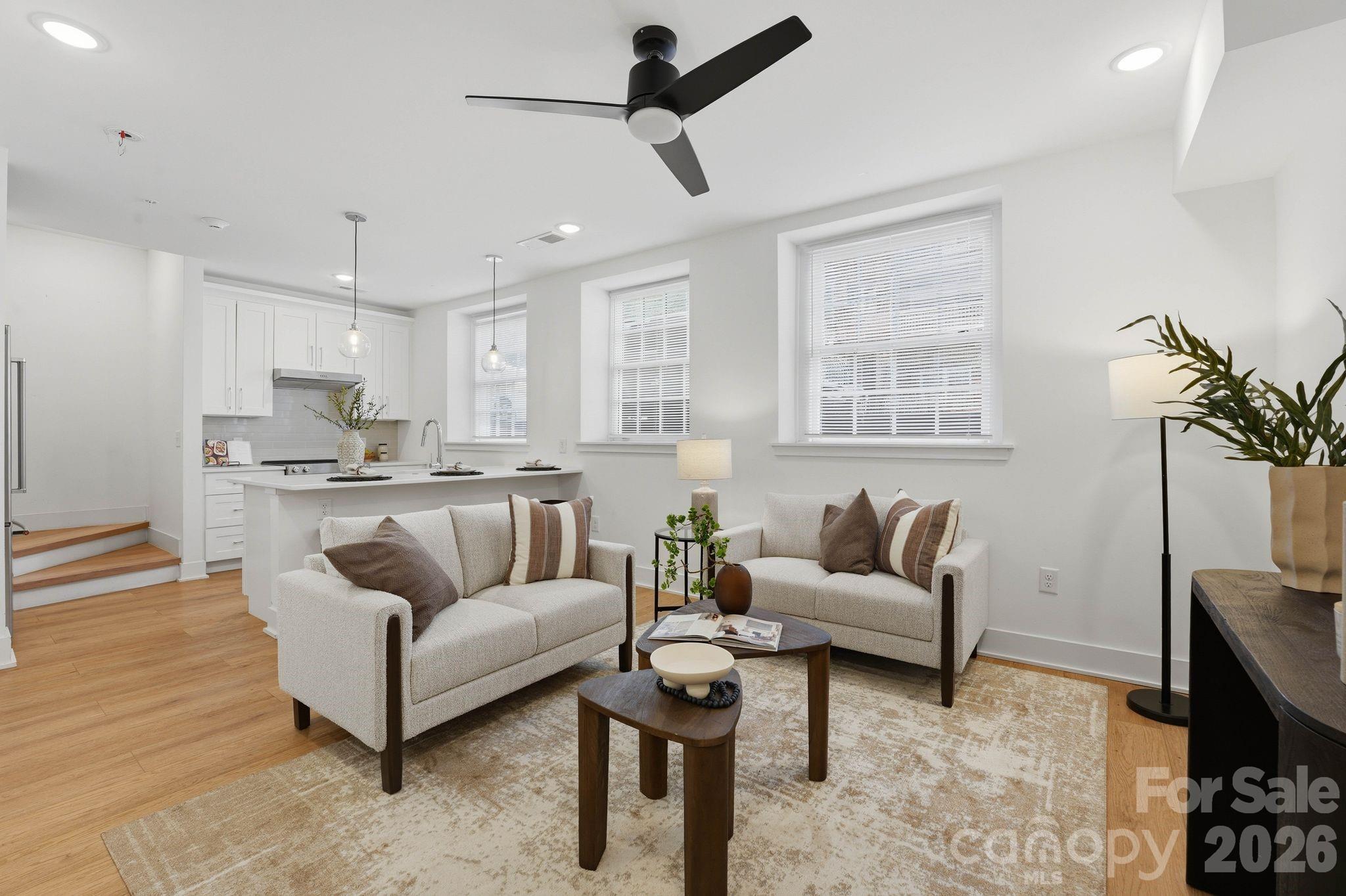 A rare opportunity to own a piece of Charlotte history — thoughtfully reimagined for modern, lock-and-leave living. Located within The Arches, a boutique collection of residences set inside a restored 1927 church in the heart of Wesley Heights, this luxury townhome-style condo offers a distinctive blend of historic architecture, modern functionality, and urban convenience. Originally built as a neighborhood church and place of gathering, the building has been carefully transformed while preserving its historic integrity, timeless presence, and architectural character. Each residence offers a private entrance, giving the home a sense of individuality and privacy rarely found in condo living. Inside, the main living area feels bright, open, and inviting, with warm wood flooring, fresh neutral interiors, recessed lighting, modern ceiling fans, and abundant natural light. The open-concept layout flows seamlessly from the living area into the kitchen, creating an easy everyday living and entertaining experience. The kitchen is beautifully appointed with white cabinetry, quartz countertops, stainless steel appliances, a tile backsplash, pendant lighting, and an oversized island with seating. Spa-inspired baths feature porcelain tile shower walls and floors, modern fixtures, and clean, elevated finishes. The private rooftop terrace is one of the home’s standout features, offering the perfect place to unwind, entertain, and take in Uptown Charlotte views and evening city lights. Additional highlights include an assigned on-site parking space deeded with the unit, thoughtful modern finishes throughout, and the unique character of a historic adaptive reuse property. Ideally located minutes from Uptown Charlotte, South End, I-77, greenway access, parks, breweries, coffee shops, restaurants, and neighborhood favorites throughout Wesley Heights, The Arches offers a rare blend of history, design, and lifestyle in one of Charlotte’s most connected urban neighborhoods.