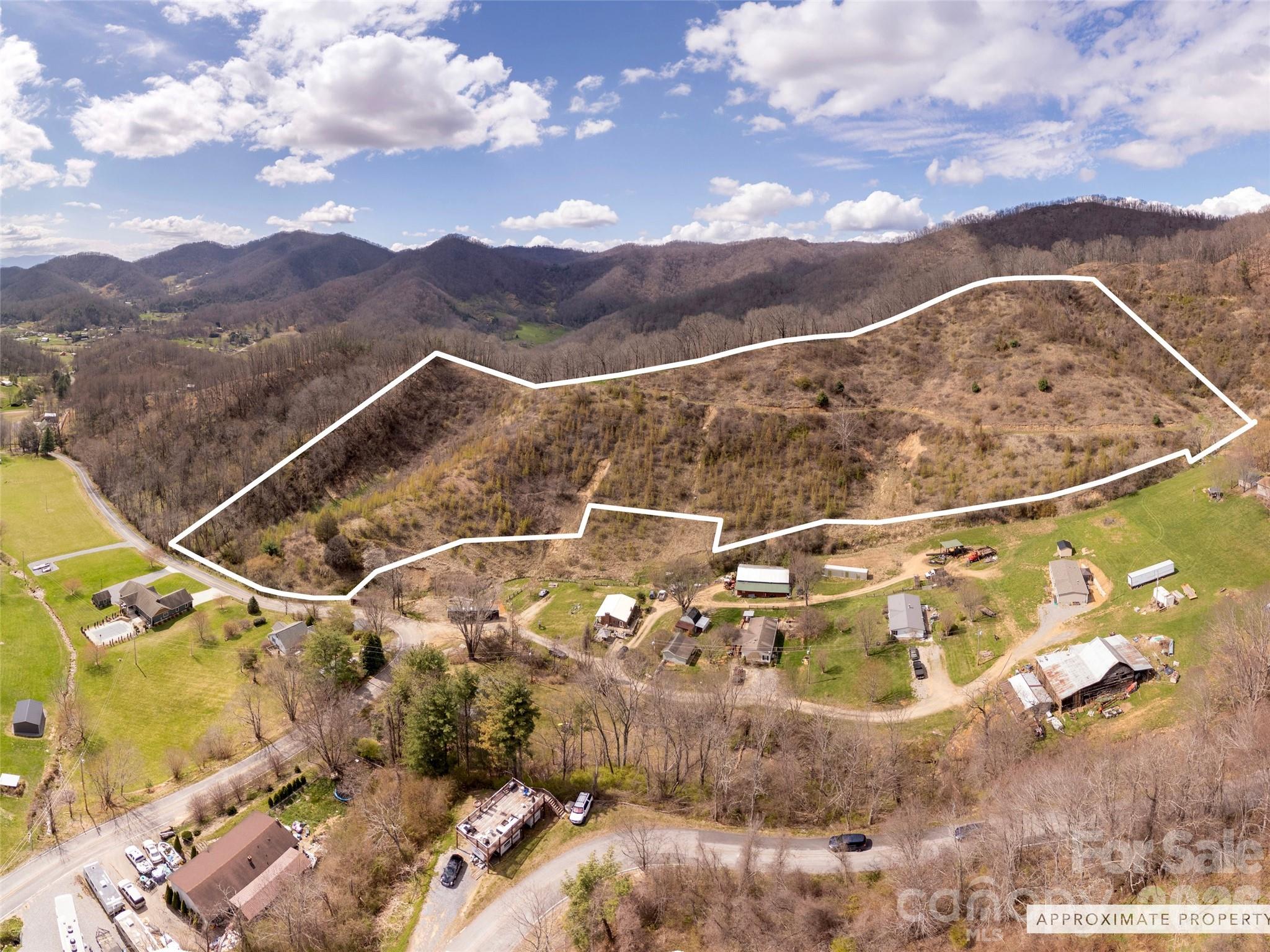 If you’ve been dreaming of a quiet escape in the mountains, this 15.06 acre property in Canton delivers. Tucked away in a peaceful cove, this land offers the kind of stillness and privacy that’s getting harder to find. A winding dirt road leads you up through the property to higher elevations where stunning mountain views await. Whether you’re envisioning a cozy cabin getaway or a secluded retreat, this property offers the perfect backdrop to unplug, unwind, and enjoy the natural beauty of Western North Carolina. Conveniently located approximately 10 minutes from I-40, less than 30 minutes to Main Street in Waynesville, and about 30 minutes to Asheville Regional Airport, you’ll enjoy both seclusion and accessibility.