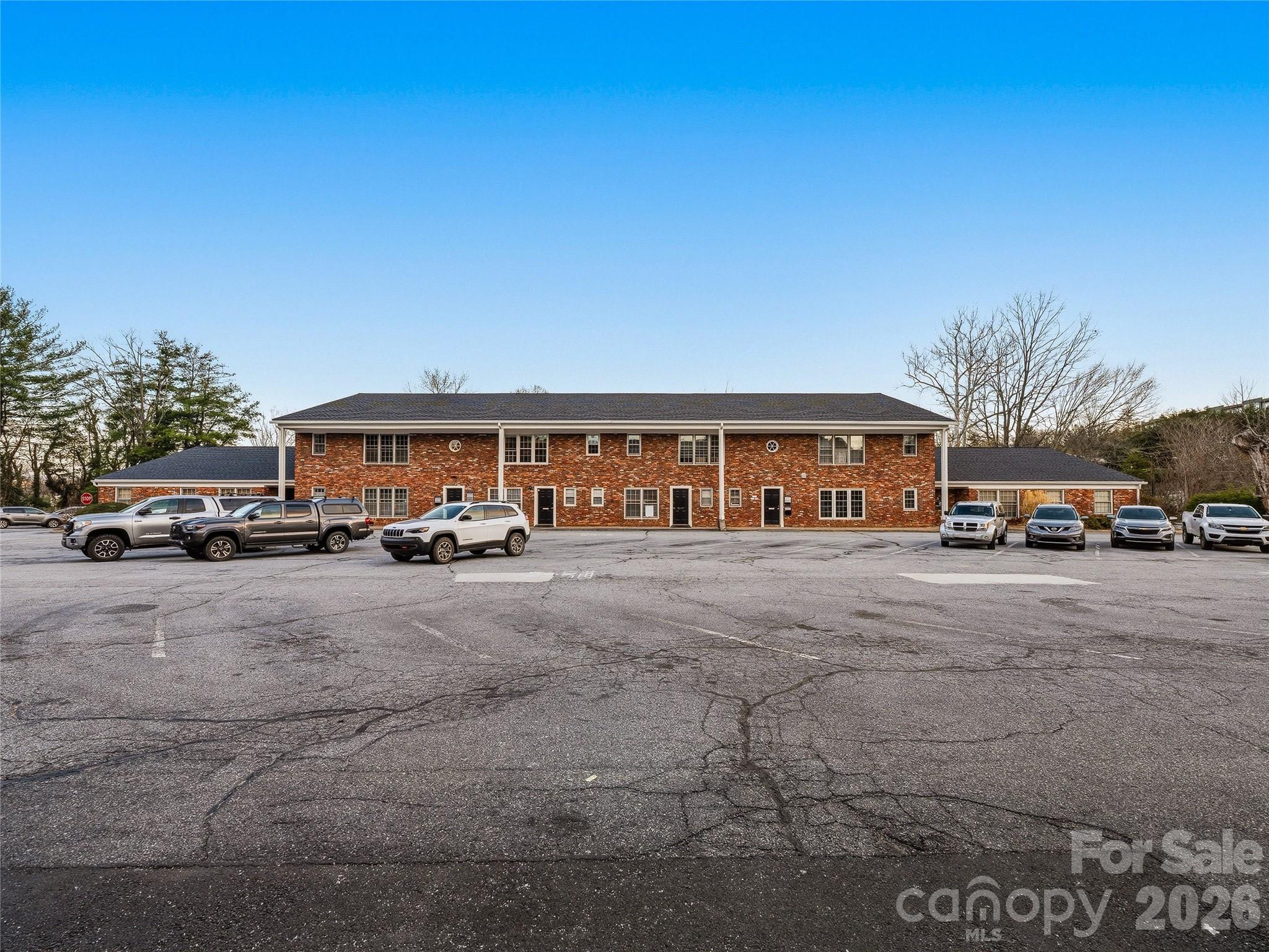 Rare opportunity to acquire a fully built-out medical office condominium in the heart of Asheville's healthcare corridor... steps from Mission Hospital and minutes from downtown. Unit 5H2 at Doctors Park offers an investor or owner-operator a turnkey income stream with immediate upside through occupancy of one currently vacant office.

The unit features five private offices - three with plumbing, suitable for exam or treatment use - along with a dedicated waiting room, reception area, break room, two restrooms, and storage. Four of the five offices are currently leased to established behavioral health, counseling, and wellness practitioners, generating $2,185 per month in gross revenue. The vacant fifth office is ready for immediate occupancy, offering an owner-operator the ability to plant their own practice within an existing, well-established medical community.

Doctors Park is one of Asheville's most recognized professional medical addresses, home to a dense ecosystem of healthcare providers across multiple disciplines. The property's proximity to Mission Hospital - HCA Healthcare's flagship regional facility - makes it a natural choice for practitioners seeking referral proximity and patient convenience. Downtown Asheville, with its amenities and strong regional draw, is less than two miles away.

The POA Fee covers utilities, common area maintenance, and parking, simplifying operating overhead for both the current owner and future tenants. At $612.95 per month, this fee is among the most competitive in the building.

Whether you are an investor seeking a stabilized, income-producing asset in a supply-constrained medical submarket, or a healthcare provider looking to own your office while generating rental income from neighboring suites, this unit offers a compelling entry point.

DO NOT DISTURB Tenants. All showings must be scheduled through List Agent(s). Proof of Funds or other Credibility Package required to schedule showing.
