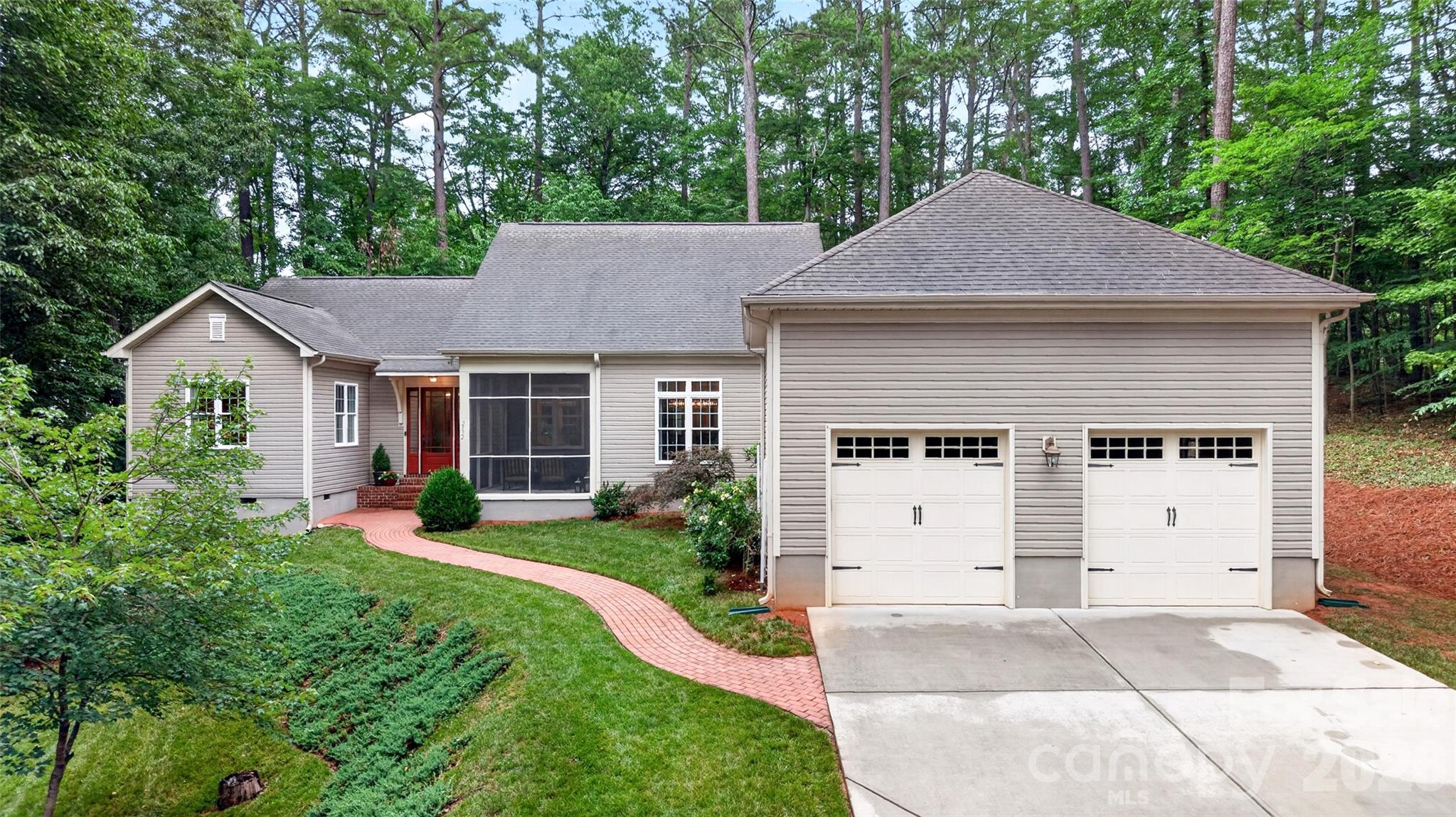 Located in one of the fastest-growing areas of the Queen City, this Oakdale area custom-built home offers high-end finishes at an incredible price with no HOA on 4 acres with private gated entrance!

Set on just over 4 wooded acres in Charlotte’s trending 28216 area, this custom-built 2013 home offers a rare combination of privacy, flexibility, and convenience. A gated drive creates a private arrival, while the single-level ranch floorplan is designed for everyday living with 10-foot ceilings, 8-foot doors, a vaulted main living area with dormer windows that frame treetop and sky views, and an open connection between the Kitchen, Dining, and gathering spaces. With no HOA fees, the property offers added freedom and value that is increasingly difficult to find in the Charlotte market. Bring your camper and boat!

The kitchen features Granite Countertops, Custom Cabinetry, soft-close drawers, a walk-in pantry, and an integrated Cabinet-Paneled Refrigerator. The split-bedroom layout places the primary suite on one side of the home and two additional bedrooms on the opposite side, ( split floor plan!) with two en-suite baths and a flexible sitting area or office space. Your guests will love it!!!

Multiple indoor and outdoor living spaces make the most of the wooded setting, including a Screened Porch, Sunroom with Fireplace, and Deck. Mature trees and a small stream running through the back of the property add to the sense of privacy and retreat. Set among neighboring acreage properties and established single-family homes, the property offers a private wooded feel within an established residential setting.

The  Spacious primary suite includes an oversized walk-in closet, dressing room, exercise/flex room, and large bath with jetted soaking tub. Convenient to I-485, Charlotte Douglas International Airport, Mountain Island Lake, the U.S. National Whitewater Center, shopping, dining, and Uptown Charlotte, this property offers the feel of a private wooded sanctuary without being remote.