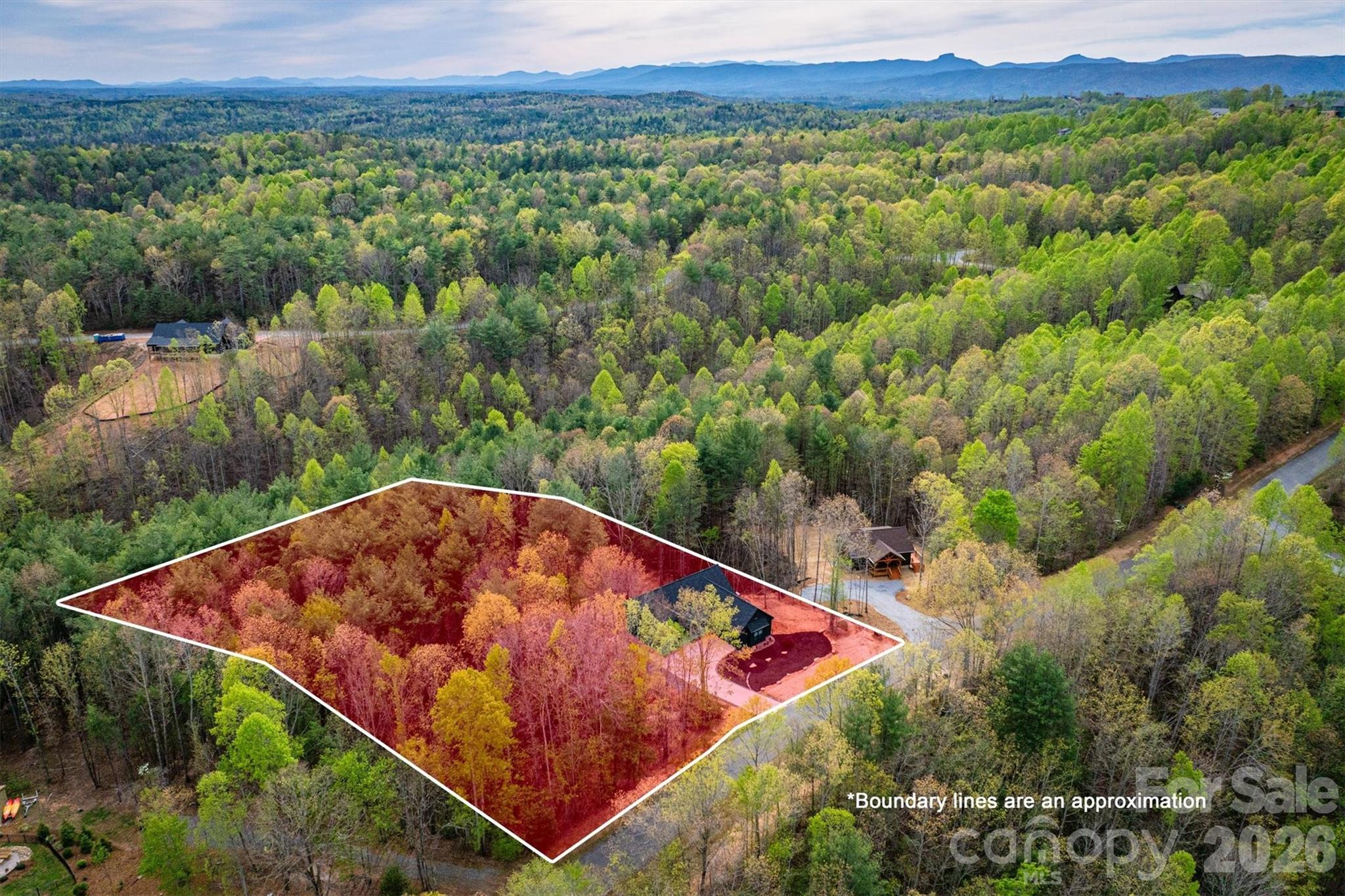 LIFE STYLE UPGRADE!  in The Coves Mountain River Club – Dual Living Spaces, 2.02 Acres on a quiet culdesac.
An exceptionally rare opportunity awaits in The Coves Mountain River Club, where craftsmanship, versatility, and mountain living converge. This 5-bedroom, 3-bath custom home sits on 2.02 acres with a peaceful creek along the rear, offering a private and tranquil setting.   Every detail, from flooring and lighting to layout and finishes, has been purposefully chosen to enhance comfort, beauty, and everyday living.
• • Completed in 2025, the main level features an open floor plan with vaulted ceilings, sophisticated lighting, and a neutral color palette, creating a bright, modern, and serene environment.  Charcoal cabinetry, quartz countertops, and stainless-steel appliances combine style with practical functionality in the kitchen.  
••The primary bedroom is a haven for relaxation and rest, with an extra-large soaking tub, walk-in shower, double vanities, and walk-in closet.
The septic system was upgraded to a 6 bedroom system and the lower level of the home was completed in March 2026.  It features a complete secondary living space with its own entrance.  The full kitchen, living room and flex area, 2 bedrooms, spare room with closet, full bath and generous storage provide flexibility for multigenerational living, guest quarters, an in-law suite, or a long-term income producing-opportunity.
Dual HVAC systems, a tankless water heater, an oversized 2-car garage with EV charging, and structural provisions for a future balcony or patio ensure modern convenience and ease throughout.  A deep, private water well with strong production adds to the property’s long-term reliability and self-sufficiency.  
This home and property combine privacy and space with natural elements, including a calming creek, hardwood trees and mountain laurel, amid a 3,200 acre gated community with unparalleled amenities. The crown jewel of The Coves is the amazing post and beam clubhouse, Pisgah Lodge, occupying one of the highest peaks, with 360° views of the Blue Ridge Mountains, South Mountains, and Brushy Mountains; you can see Mt. Mitchell, the highest peak east of the Mississippi, from the back deck. Also at the clubhouse: great room with vaulted ceilings and 3-sided fireplace, full kitchen, saline pool, fitness center, locker rooms, lending library, pool table, ping pong, porches and decks with rockers, and fire-rings! Hike, bike, ride horses or UTVs on the private community trail system.  There are 5 miles of the Johns River on site with kayak access points and picnic areas.  The Coves is a Firewise USA® Community, a program of the National Fire Protection Association, that helps neighbors organize to reduce wildfire risk, harden homes, and create defensible space by managing vegetation and preparing for wildfires. Additional amenities include 2 equestrian centers, a community garden and vineyard, a dog park and pickleball courts.  30+ clubs planned activities and excursions.  500,000 acre Pisgah National Forest and the Wilson Creek Wild and Scenic River area are just outside the gates. Minutes to Blowing Rock NC, Lenoir NC, Morganton NC, and the Blue Ridge Pkwy. 1.25 hour to Charlotte NC or Asheville NC.