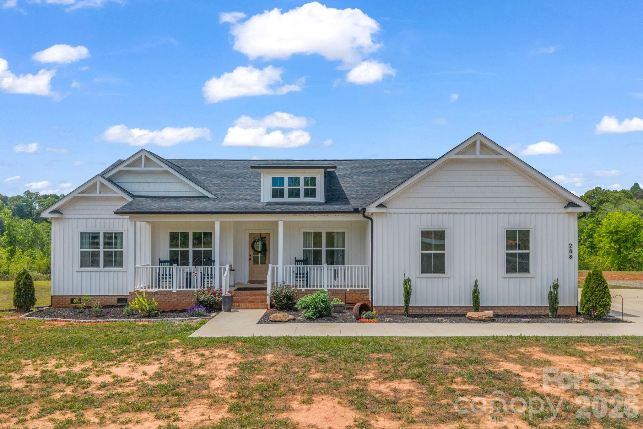 Tucked away on 25 private acres, this stunning 2023-built estate offers the best of upscale country living. The open-concept 3BR/2.5BA home is thoughtfully designed with a well-appointed kitchen with island, dedicated office space, formal dining room, breakfast nook, and a spacious laundry room. The primary suite is a true retreat — double vanities, soaking tub, separate shower, and a walk-in closet. A covered front porch and attached 2-car garage complete the home. Outside, a detached 30x40 insulated workshop with 3 bays and 12-ft lean-to, a 12x24 storage building, fenced garden, and 1.5± acres of fenced pasture deliver unmatched versatility. Privacy, quality, and space!