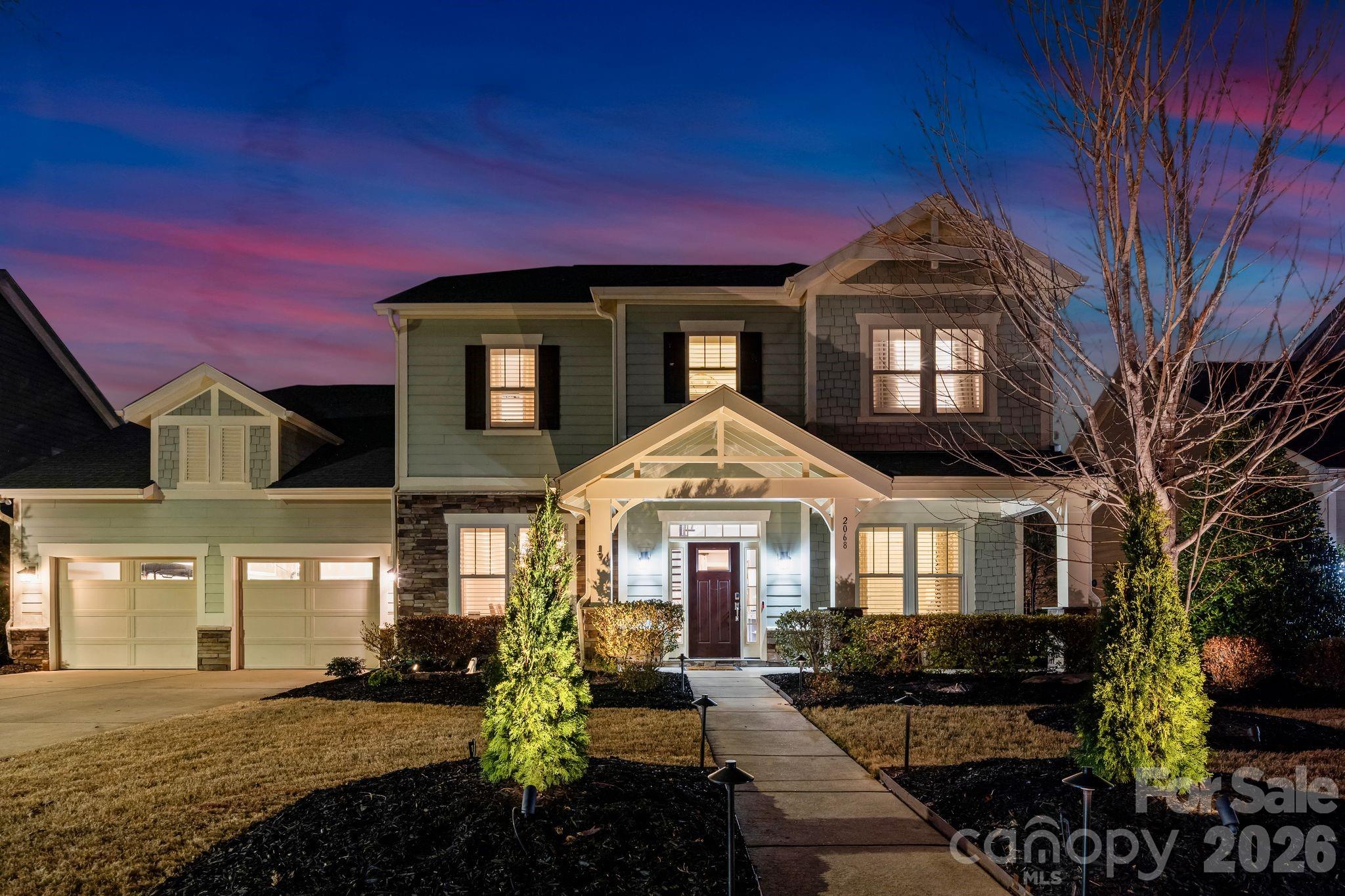 Model homes are designed to showcase the very best a community has to offer—and the home that helped introduce Paddlers Cove is now ready for its next owner!

As the original model, this home is filled with upgrades and custom details throughout. One of the most striking staircases in the neighborhood makes an immediate impression, while extensive built-ins and thoughtful design, coffered ceiling, and elements elevate all the living spaces. The upgraded kitchen was designed for both beauty and function, cabinetry to the ceiling, lit soffits, drawer microwave, double oven, gas appliances, and complemented by a butler’s pantry featuring a wet bar and wine fridge, along with a tucked-away planning center just behind the kitchen—perfect for a home office, organization hub, or homework space.

The living room is anchored by a gas fireplace and coffered ceiling with premium lighting, while the screened back porch features a beautiful stone fireplace for year-round outdoor enjoyment. Outdoor living continues with a travertine patio and outdoor kitchen complete with a built-in grill connected to natural gas—ideal for entertaining.

Additional highlights include underground gas service, self-start gas fireplaces, and a whole-home water softener and filtration system.

Positioned on a premium lot, the backyard offers direct access to the community pool—creating a rare opportunity to enjoy resort-style amenities just steps from your own home and a golf-cart drive away from top-rated schools!

Located in the highly sought-after Paddlers Cove community with exceptional amenities nearby for sports and exercise for all

A rare opportunity to own one of the homes that helped set the standard for the entire neighborhood!