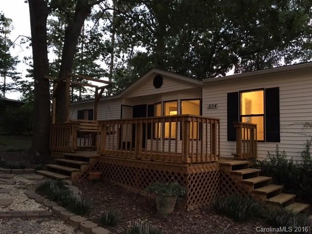 Spacious home on over 1+ acres. Move in ready with large master bedroom, kitchen and additional bedroom. Quaint dining room with open floor plan to kitchen and lving room. Nice office with separate entry. Front and rear decks great for entertaining. House has enough space to add another home or garage. Secluded on wide wooded lot with fenced back yard, animial fence with housing, and outbuilding. Great school system.