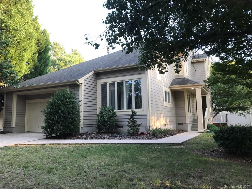 Lovely contemporary style home with two car garage on a corner lot adjacent to common area. Features include an open floor plan with hardwood floors, sunken LR, wood burning fireplace & vaulted ceiling. Dining area has half wall & decorative columns.Kitchen has ample cabinets, countertop space & large windows in eating area. Master suite with dual WIC & spa-like deluxe bathroom with jetted tub. Spacious secondary bedrooms upstairs with new carpet. Enjoy the deck off the living & master bedroom.
