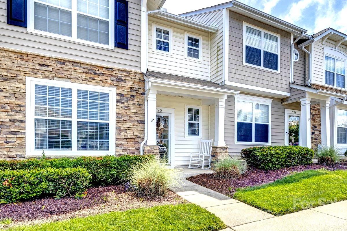 Don’t miss this beautifully updated, low-maintenance townhome in the highly desirable Fieldstone community of Fort Mill. Upon entry, you’re welcomed by a versatile flex space ideal for a home office, playroom, or additional living area. The open-concept great room features a cozy fireplace and flows seamlessly into a modern kitchen complete with granite countertops, neutral colored cabinetry, tile backsplash, pantry, and stainless steel appliances, including a brand-new dishwasher. The adjacent dining area is perfect for everyday meals and entertaining.

Upstairs, the spacious primary suite boasts a vaulted ceiling, walk-in closet, and private ensuite bath. Two additional bedrooms share a full bathroom, offering comfortable accommodations for family or guests. Enjoy outdoor living on your private, fenced-in patio - complete with a storage room - while the community pool and clubhouse are just a short walk away.

Recent updates include a plumbing re-pipe (2024), AC unit (2023), LVP flooring (2023), half bath vanity (2023), updated lighting and ceiling fans (2023), and a new stainless steel dishwasher (2026). The HOA covers landscaping, roof maintenance, trash & recycling pick-up, and termite treatment for low maintenance living.

Conveniently located near shopping, dining, major highways, and top-rated Fort Mill schools, this move-in-ready home truly has it all. Schedule your showing today!