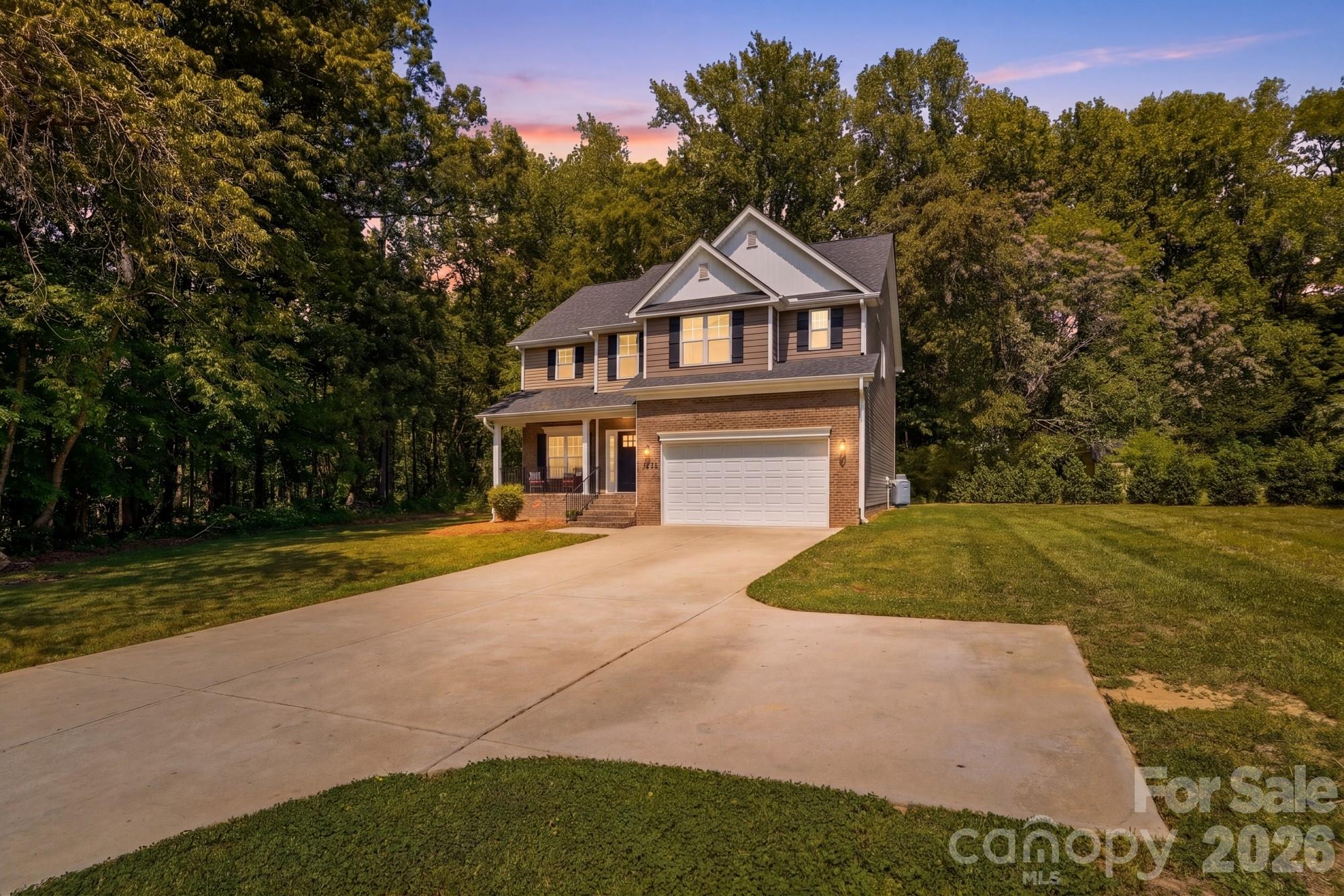 Motivated seller... schedule your showing! **NOW OFFERING A $4,500 LENDER CREDIT AT CLOSING FOR ANY BUYER THAT USES OUR PREFERRED LENDER. Looking for acreage and privacy?  This exceptional property delivers both.  This one-owner home, built in 2022, has been meticulously maintained and is situated on 1.92 acres, offering a peaceful wooded setting.  A long private concrete driveway leads to a spacious two car garage, providing both convenience & curb appeal.  Inside, you'll find an open and inviting floor plan featuring 3 bedrooms plus a versatile bonus room/optional fourth bedroom (on septic), along with 3.5 baths.  The beautifully appointed kitchen showcases granite countertops, a large island and a walk in pantry-perfect for both everyday living and entertaining.  The main level offers seamless open concept living with a cozy family room complete with a fireplace, as well as a separate dining room or study to suit your needs.  Durable luxury vinyl plank flooring runs throughout the main level.  The spacious primary suite boasts vaulted ceilings and an oversized walk-in closet. The en-suite bath includes a relaxing garden tub and a separate walk in shower.  Don't miss this opportunity- schedule your private showing today!
