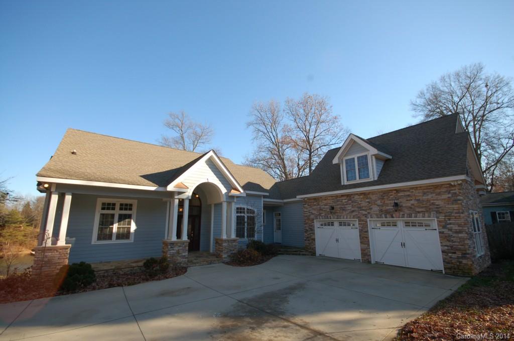 Location, Location, nice waterfront, minutes to I-77 at Exit 33 in Mooresville, NC.  Charming home located on a beautiful .48 acre lot in Mooreland Estates neighborhood.  Great views of Lake Norman, stainless appliances, granite counter tops, two stoves, two fireplaces. Master bedroom on main, bonus on upper level over garage, finished basement with great room and 3 secondary bedrooms, covered deck below, open deck on main, two car garage.  Neighborhood has Lake Norman access with boat ramp,