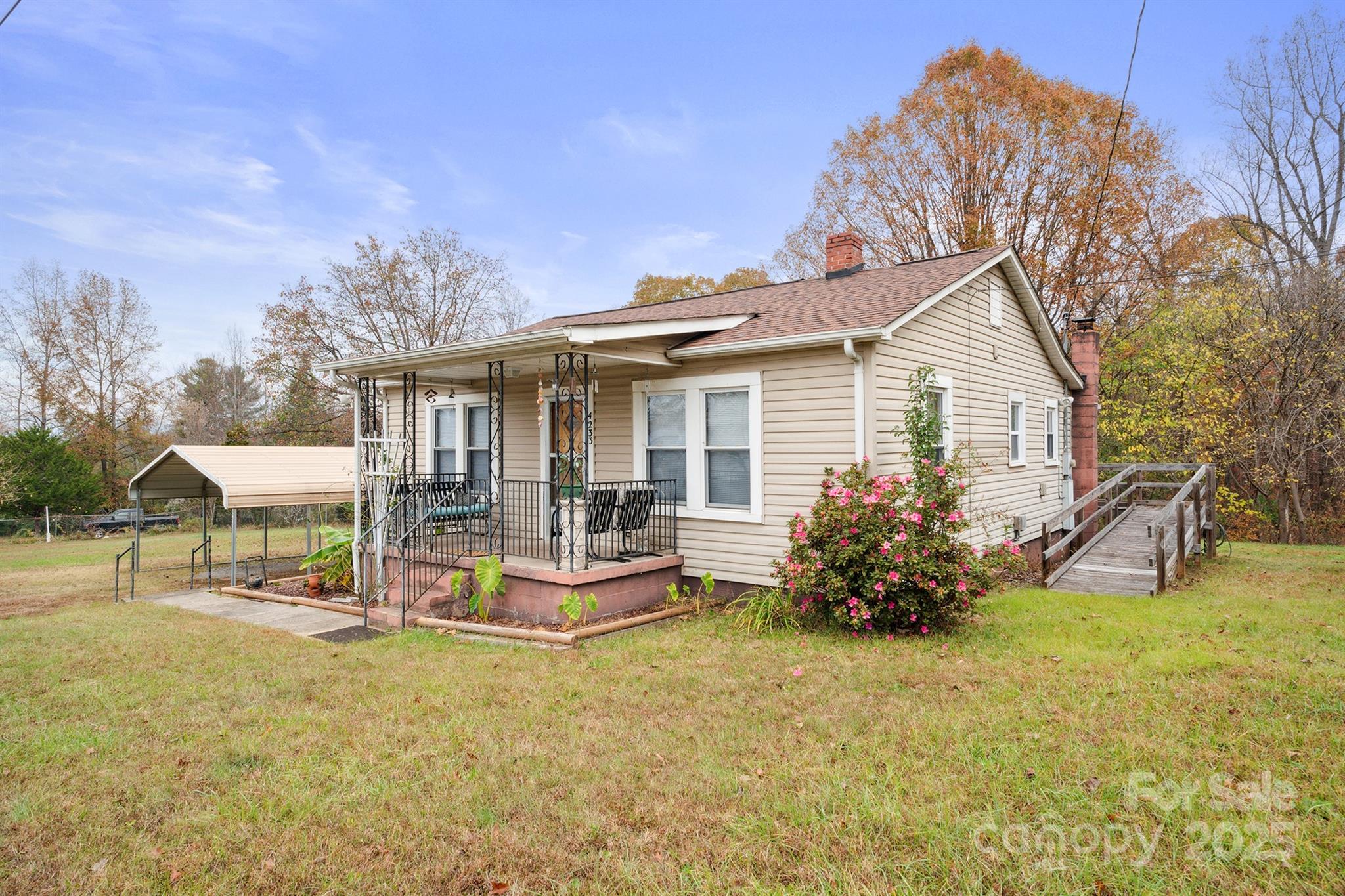 Well loved! Original owner. An adorable prettier in person 3Br/ 1Ba cottage home on 0.8 acres w/stream, detached carport & outbuilding. Open back deck & user friendly ramp. Welcoming front covered patio opens to charm and a "feel at home" one level floorplan. Custom built-in hard wood cabinets & shelving throughout the home. Hardwoods under the carpet and vinyl flooring. Large primary bedroom w/ two additional spacious bedrooms, lots of closet space and a full updated bathroom w/walk-in shower. Huge kitchen with dining area, breakfast bar, tons of storage, appliances & a vintage wood stove. Separate laundry & mud room. New replacement windows, Newer roof.  Easy to show. Shown by Appointment.