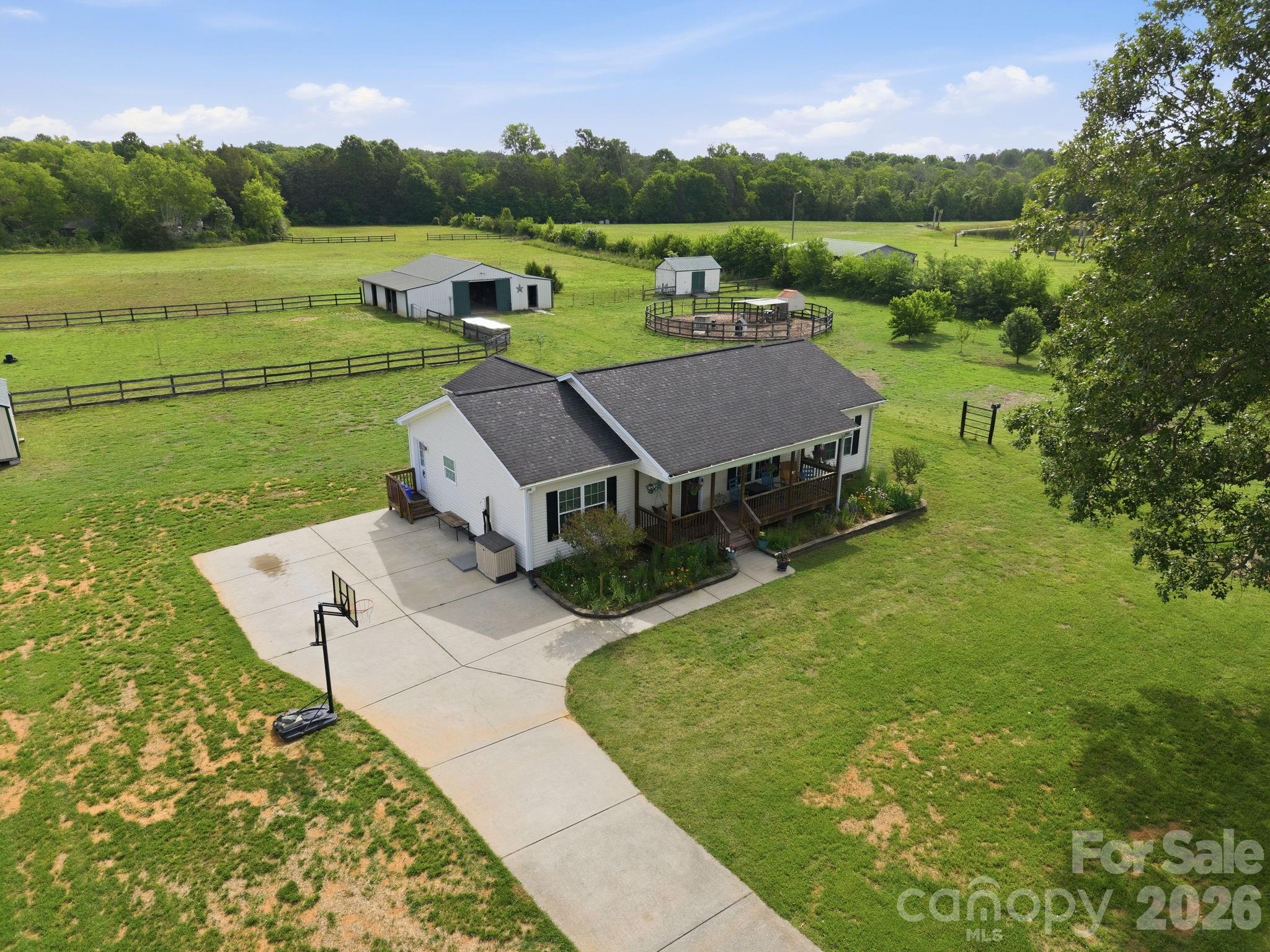 Welcome to 3480 Skyline Road! An equestrians dream!  This beautiful horse farm is nestled on 7.5 acres you will find a beautiful 3 bedroom, 2 bath home that offers the perfect blend of peaceful, rural living with modern day comfort. Surrounded by gorgeous views and mature oak trees, this property is ideal if you are looking for privacy, space and a place to call home for you and your horses, livestock, crops and more.

This home has gorgeous hardwood floors throughout, updated bathrooms and appliances, a covered front porch as well as a screened-in back porch overlooking 3 separate paddocks, a 160' round pen, and a 1,824 SF barn with three stalls and plenty of room to expand. There is also a beautiful fruit orchard (peach, plum, apple, blackberry and blueberry), , a grape arbor, two storage sheds and many newly planted trees that will grow for your added privacy. Additional features: Outdoor shower, RV hookup, water-filtration system, newer HVAC (2024) and hot water heater (2023).

Located just ten miles from I-77, and minutes away from downtown Rock Hill you can have the perfect combination of convenience and private rural living.