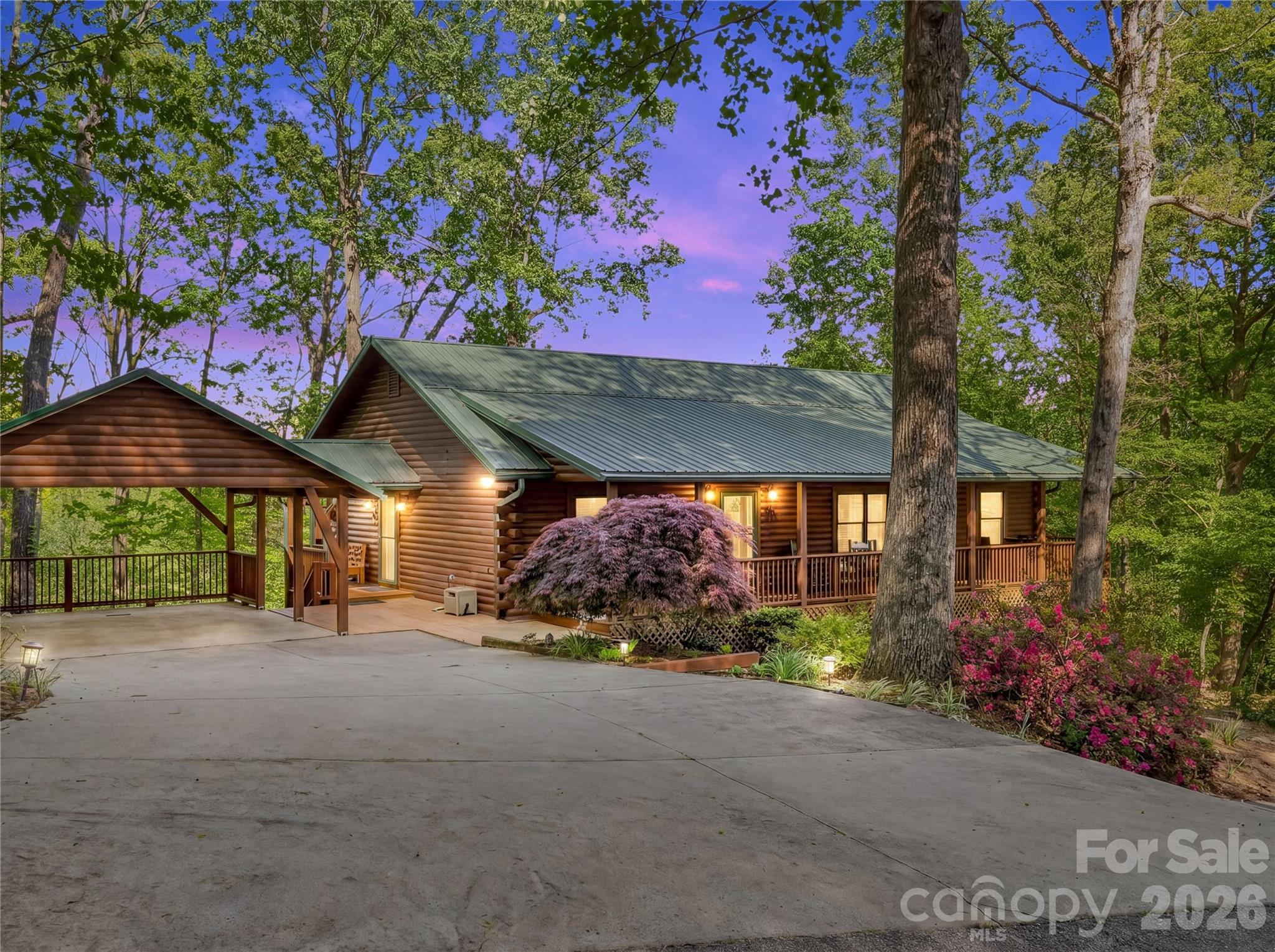 First time on the market, this delightful custom log cabin has a fully finished, currently unheated basement with full bath that doubles your potential living space! This Glen Echo beauty is minutes from the town of Saluda with easy access to 26.  It has everything you need for one-level living PLUS the finished lower level that can be accessed from either the inside or outside, perfect for guests, a mother-in-law suite or even a separate apartment.  One basement room is already heated. Add some baseboard heat or mini splits for year round living downstairs.  This lovely home has 3 ample sized bedrooms and two full baths upstairs.  A covered porch runs the full length of the front of the home where you can enjoy the beautiful Japanese maple and azaleas blooming while you greet your neighbors.  The rear of the home has a completely private covered deck with beautiful winter mountain views which could be opened up for more year-round views.  The home has a stone fireplace with gas logs and a full house generator that can easily be hooked up when there is a power outage.  There is ample parking in the two car covered carport and two more cars could fit in the driveway.  There is little grass to mow, mostly just some beautiful landscaping plants to enjoy.