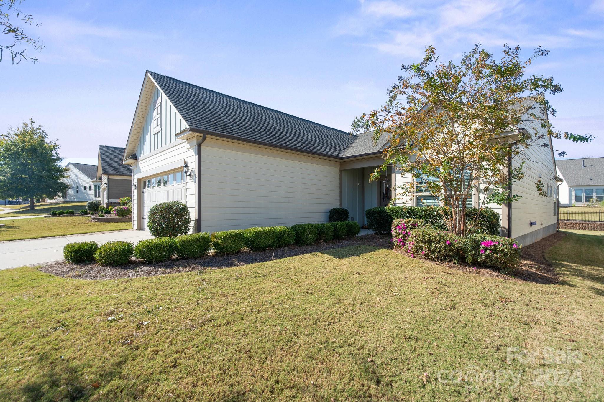 Welcome home to your 2 BR 2 Bath Castle Rock Model in the award winning active 55+ community of Carolina Orchards.  Move-in ready, this home is crafted for your next chapter.  From the spacious Kitchen w/tons of cabinets and open living spaces to the Sunroom + 3 season Champion glass enclosed porch + paver patio w/awning + gas line for barbecue - all perfect for entertaining or relaxing. 4' extended garage w/epoxy floor + pull-down attic storage + whole house water filter + utility sink. Perfectly located across from Anne Springs Greenway + easy access to Charlotte, the airport, shopping, & restaurants for those who love nature & convenience. Amazing amenities include indoor/outdoor pools & hot tubs, 8 lit pickleball cts, 4 lit clay tennis cts, 2 bocce cts, fitness center, meeting rms, playground for grandkids, dog park, full-time on-site Lifestyle director w/many clubs & activities to choose from. Come join us in the Orchards - it's a great place to call home.