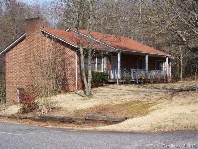 Solid, spacious, all brick home conveniently located across from Civitan Park and near Hampton Heights Golf Course and Lenoir-Rhyne University. Main level has huge LR and 2 large bedrooms. Master boasts a large WIC and full private bath. The lower level has a large greatroom with closets and a full bath that could be a bedroom suite. Wood stove for additional heat source. Private back yard and large covered porch and back deck. Additional lot next door included.