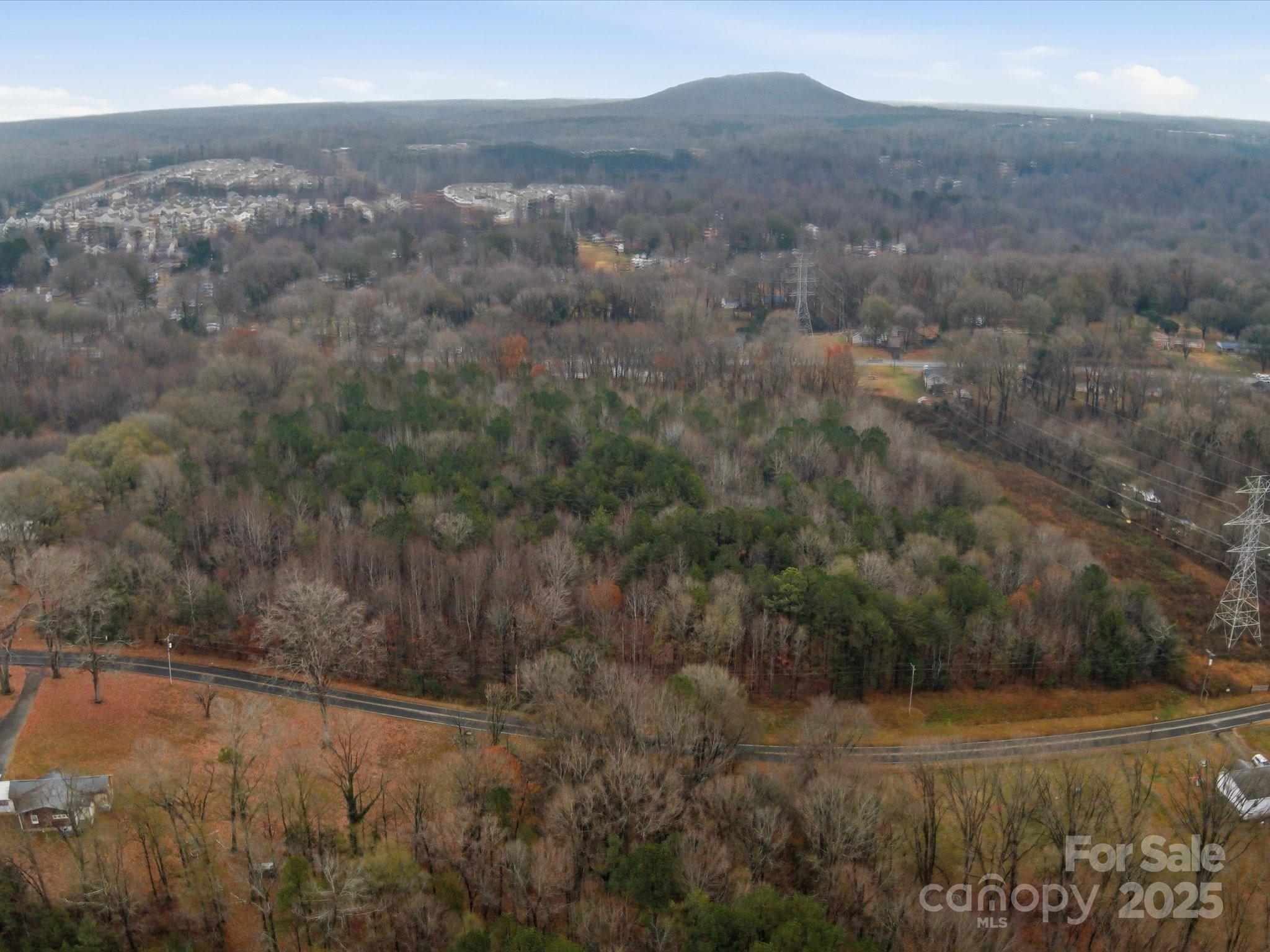 Stunning property (total of 4 parcels/ 16.83 acres) with 2 access points (one access point on Lowery Dallas Hwy, the other on Rosewood Dr). Approx total road frontage is 1,414 feet. Lower Dallas road frontage is around 496 feet. Rosewood road frontage is around 918 feet. Perfect for residential development. Currently zoned as RS-8/RS-12. Water/sewer available. Only minutes from Two Kings Casino, Shopping, Restaurants, and CaroMont Hospital. Also, very close proximity and easy access to I-85 and 321. Fantastic location and even better property.