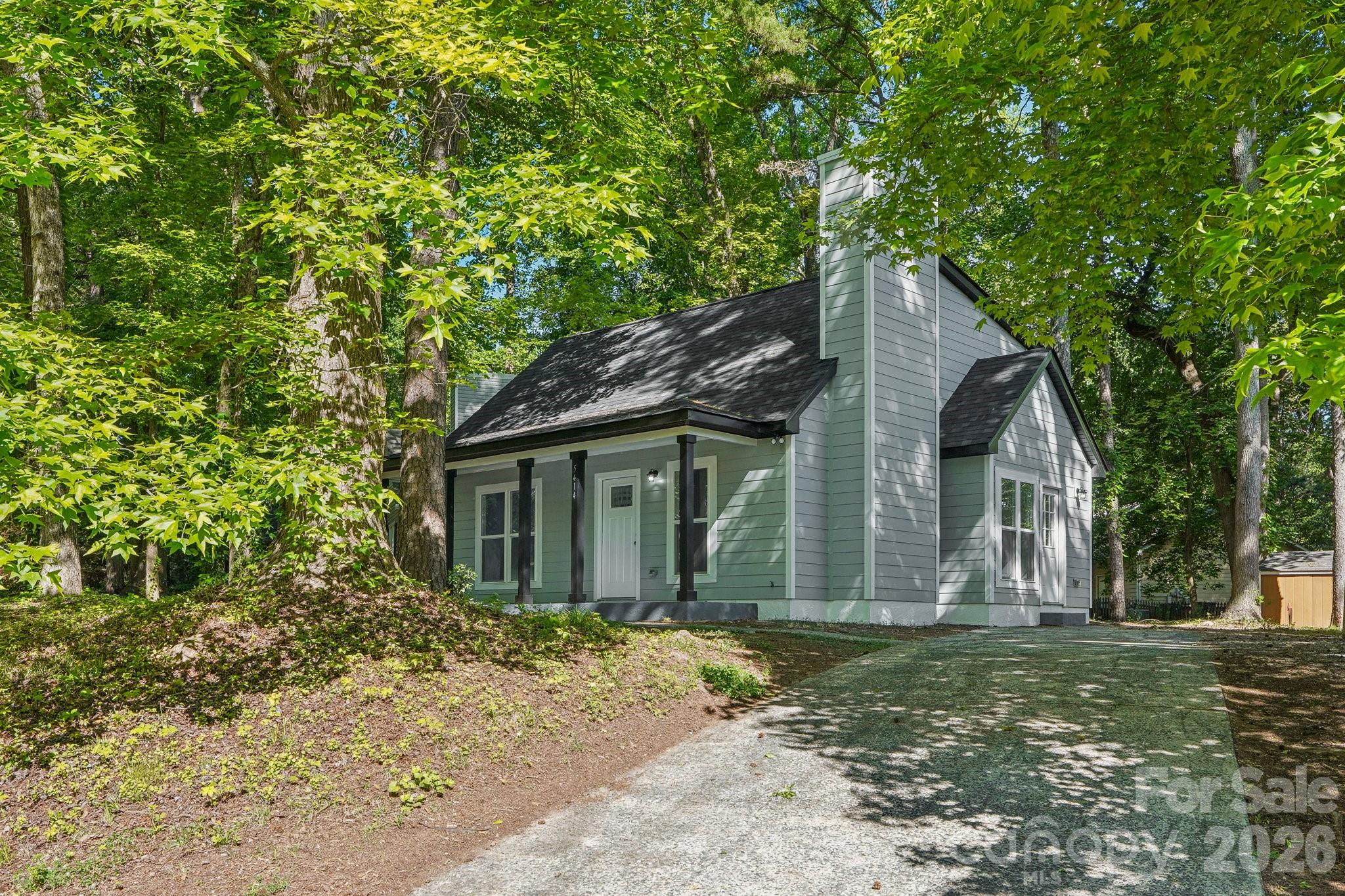 May qualify for 100% financing and local assistance programs!!!  Ask your lender for details and schedule an appointment to see this beautifully remodeled cottage-style home. The open floor plan is accentuated by a warm fireplace, creating a cozy atmosphere for both relaxation & entertaining. This isn't your typical cookie-cutter house with its stylish bathroom tiles, hardwood floors, new roof & windows, & a movable kitchen island. The community clubhouse can be rented for your activities and has 2 pools for summertime fun. The property was recently surveyed, staked, and is waiting for HOA wooden fence installation approval. Lynton Place residents enjoy easy access to Albemarle Road, leading directly to Uptown Charlotte. It's conveniently located near dining & attractions within a 5-mile radius. Don't miss the opportunity to own this move-in-ready gem. Learn more about the community at https://www.lyntonplacecommunity.com/.