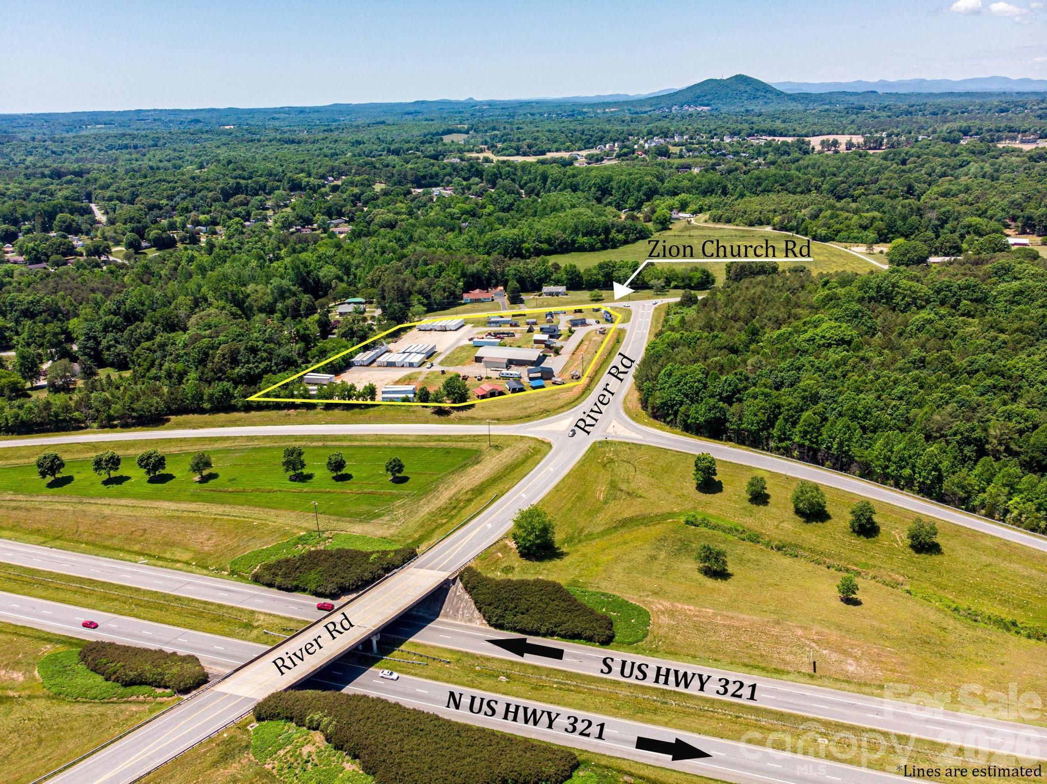 Hard-to-find commercial mixed-use parcel with exceptional exposure and direct access along one of the Catawba Valley's most-traveled corridors. Zoned 321-ED(MX) with ED-O overlay — built for commercial, retail, service, and mixed-use along Hwy 321. With significant new residential development underway nearby, the site is ideally positioned to serve growing demand. Existing 6,000 SF metal building offers immediate utility, equipped with 10' x 10' ground level door and 12-14' clear height in warehouse, and the 5.16-acre site allows for yard storage, expansion, or redevelopment.